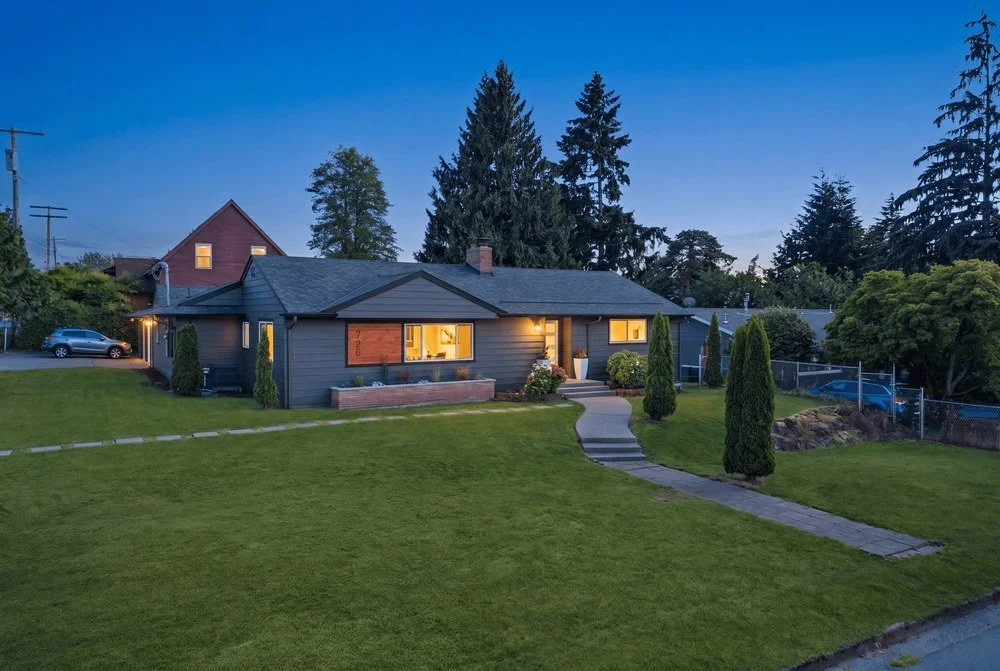 The Scenic Hill Flip in Kent, rambler exterior at twilight after full permit renovation