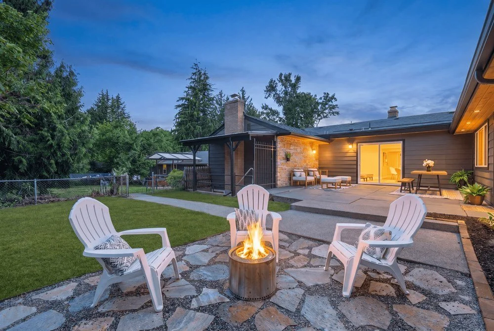 Scenic Hill Flip: Backyard fire pit at twilight