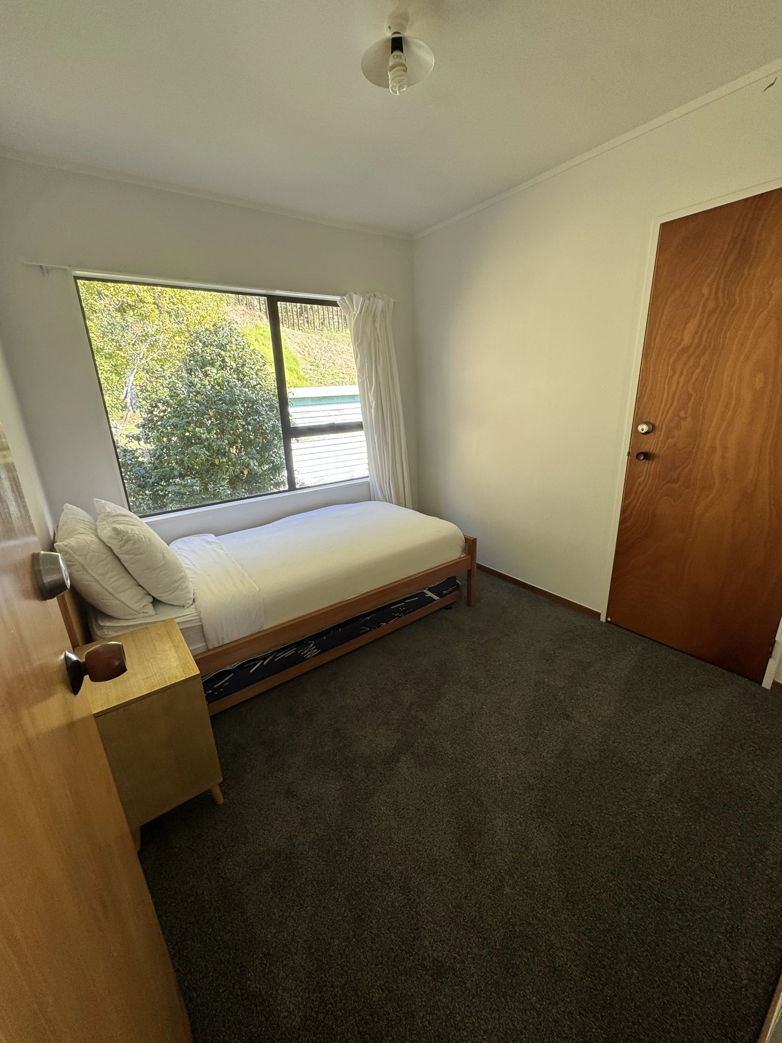 Upstairs single bedroom with single rollaway bed