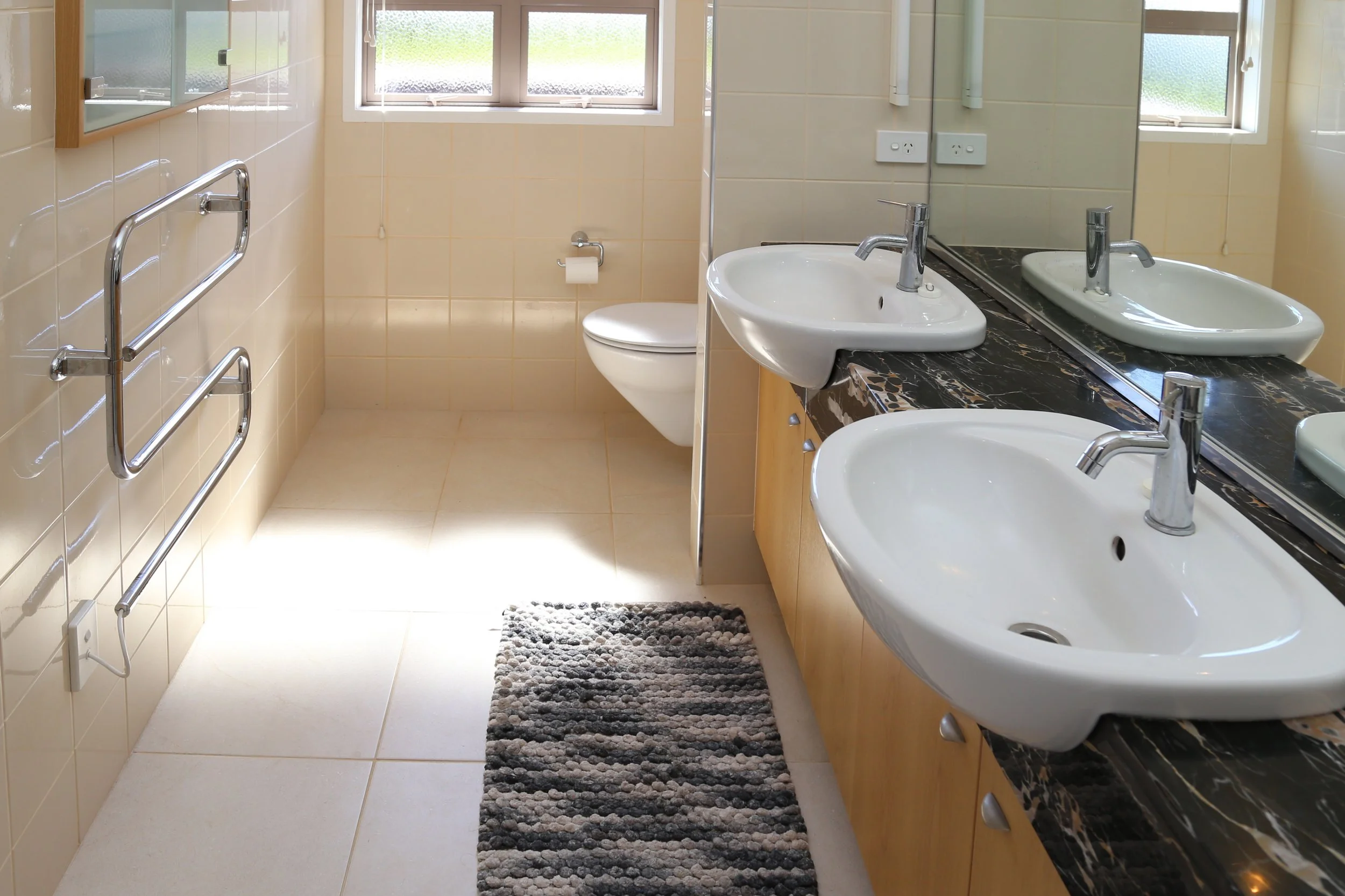 upstairs bathroom by master bedroom with double basins