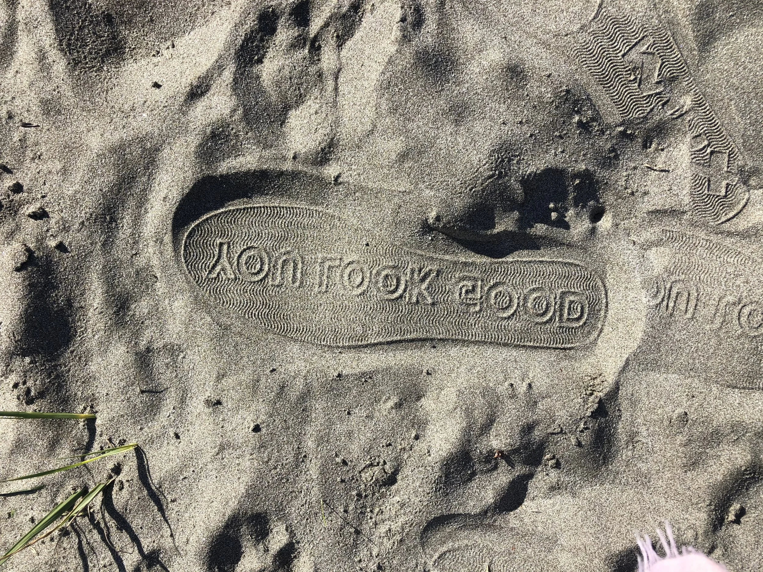 "you look good" footprint in the sand