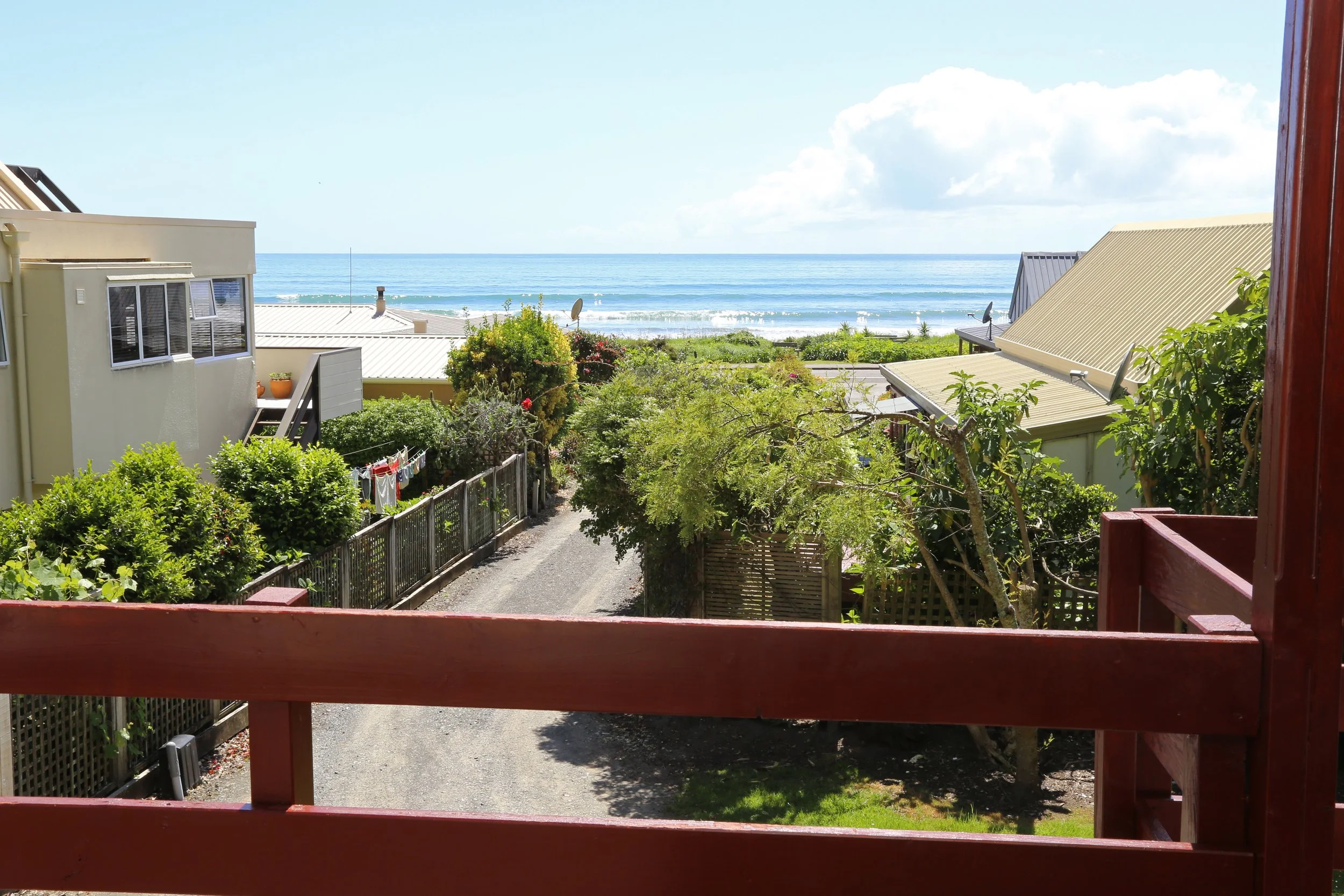 Listen to the waves and watch the surfers from front deck