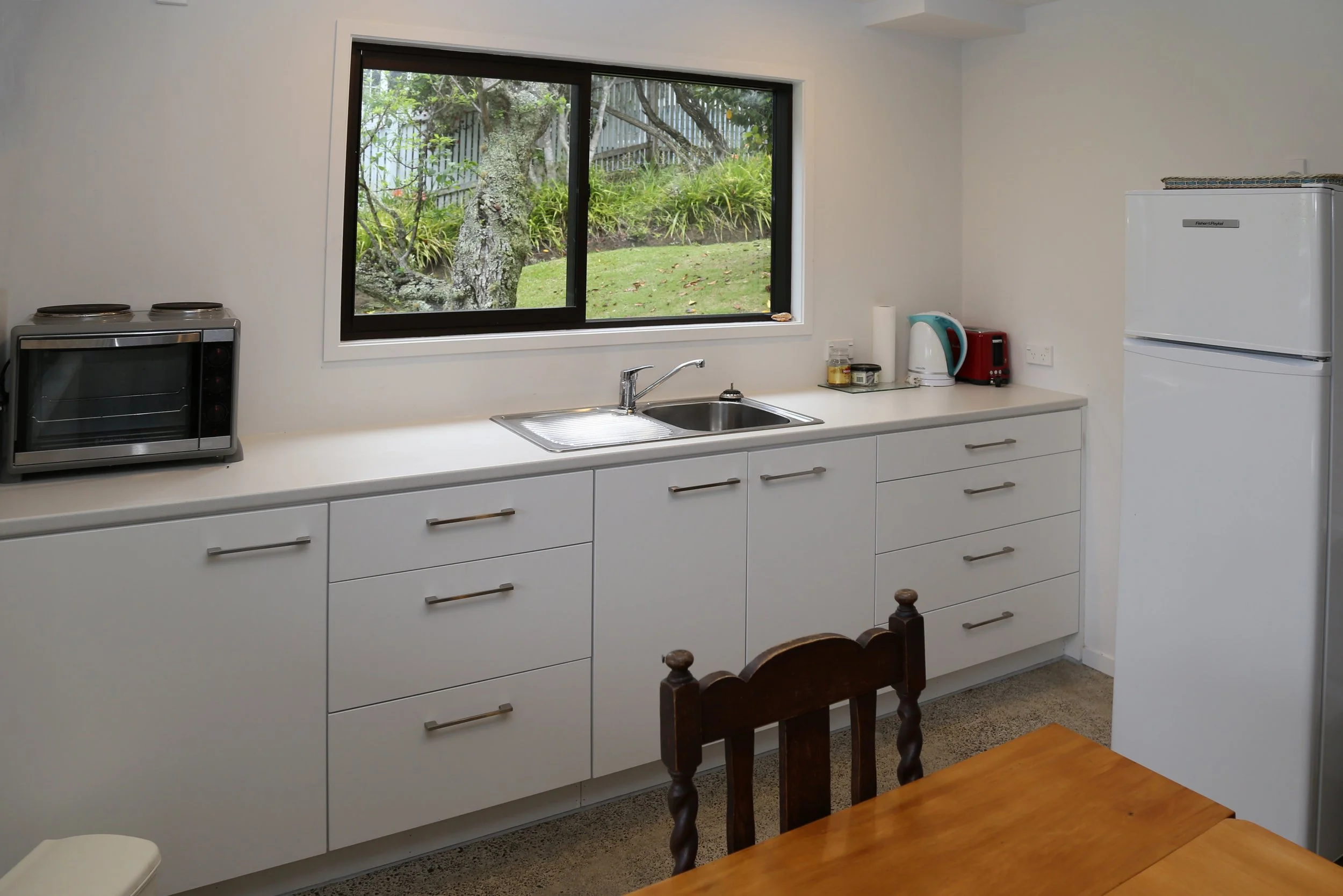well set up kitchenette area with fridge-freezer