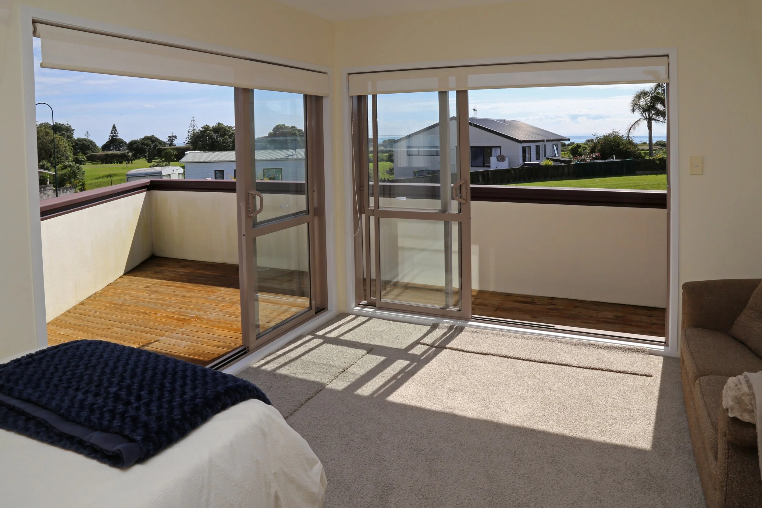 3rd bedroom upstairs - king single with single rollaway bed (can be made up as super king bed) has its own balcony and views towards beach