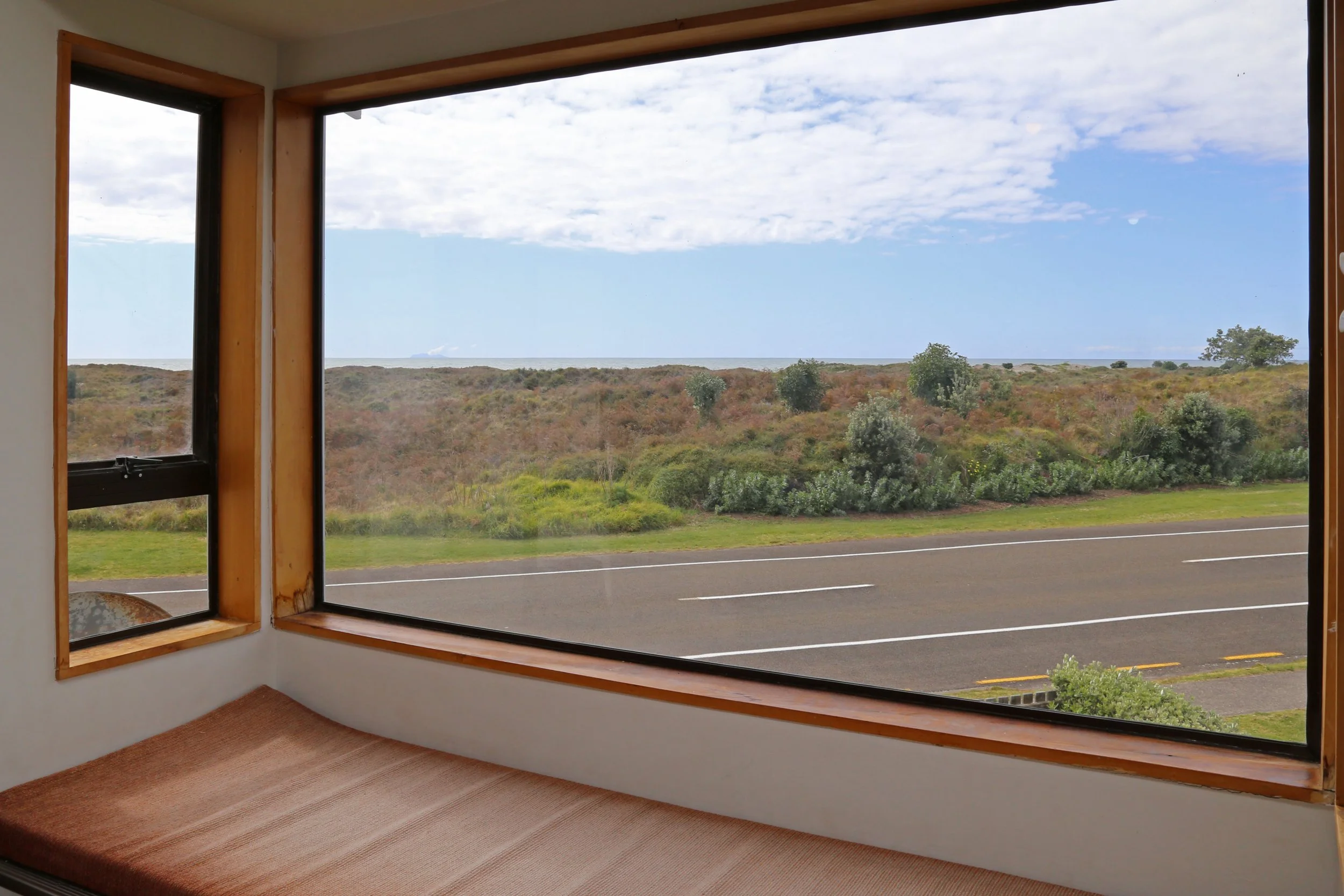 Sea views over sand dunes from lounge-living