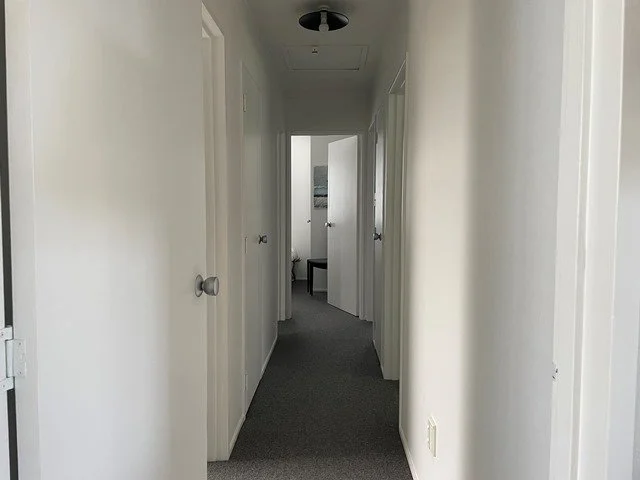 Hallway from living to bathroom & bedrooms