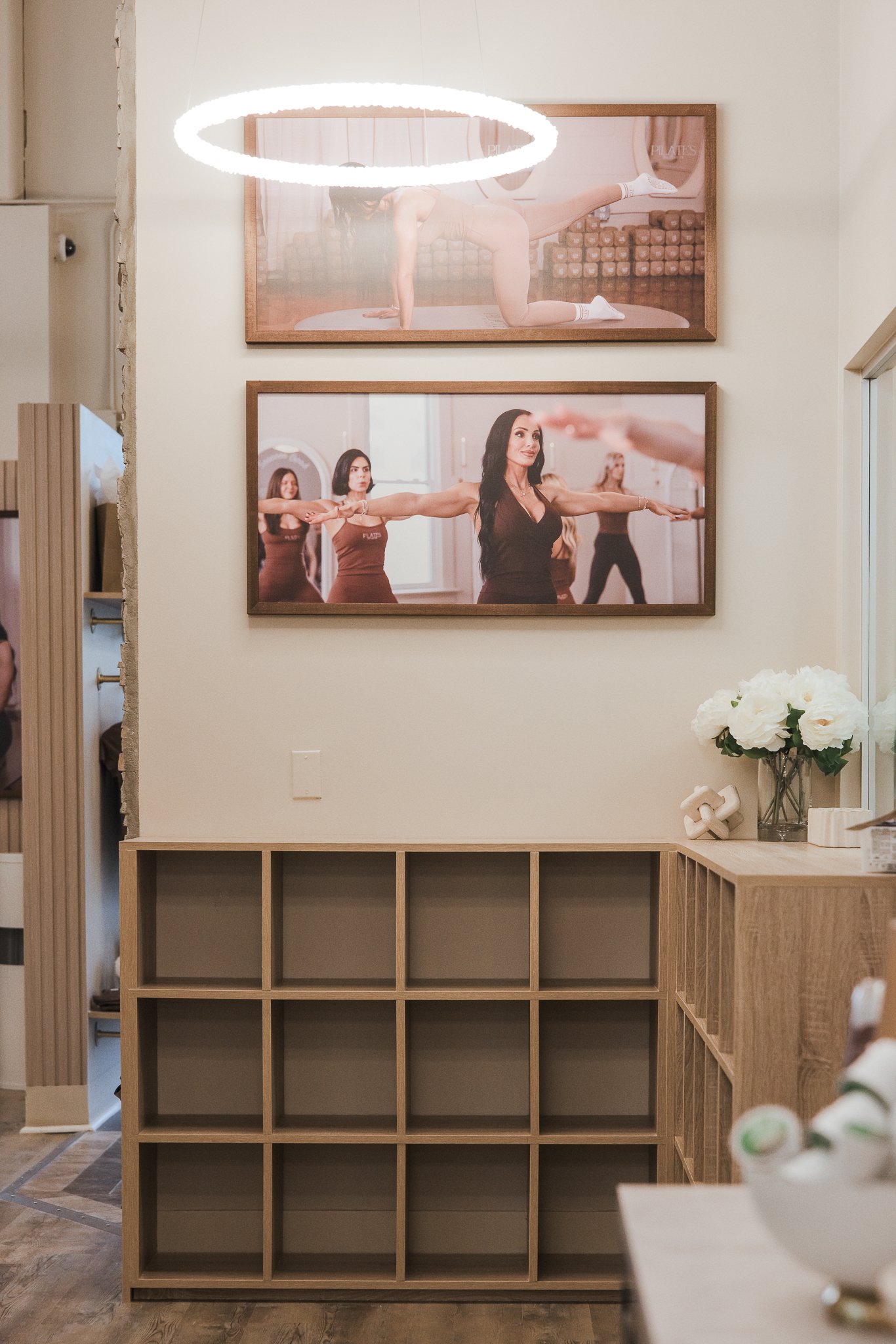 Pilates by Ashtyn Westerville studio interior with Pilates artwork and storage cubbies