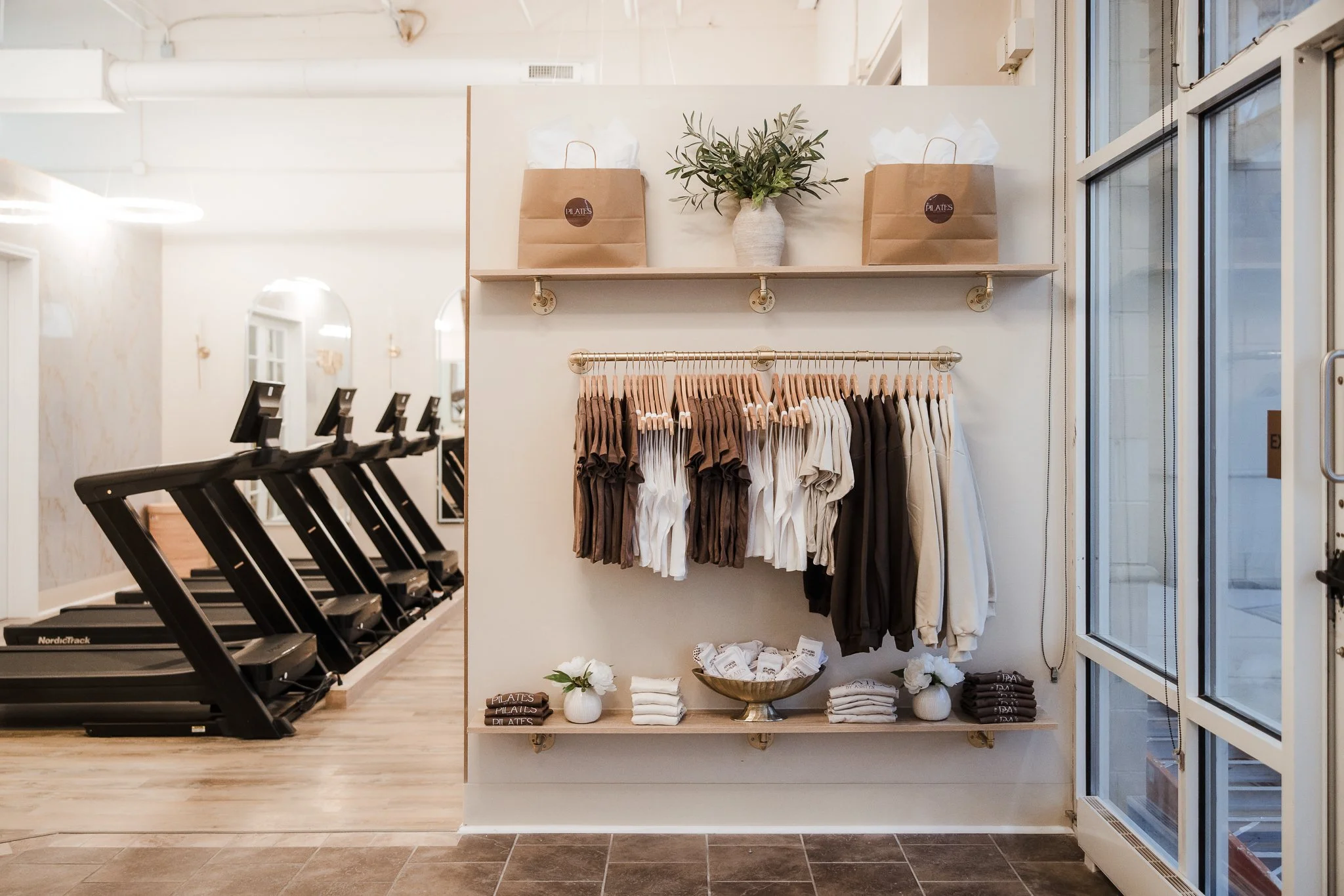 Pilates by Ashtyn Westerville retail area with apparel and treadmills