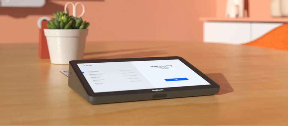 Close-up of a roller mechanism installing a black window or door screen in a frame.