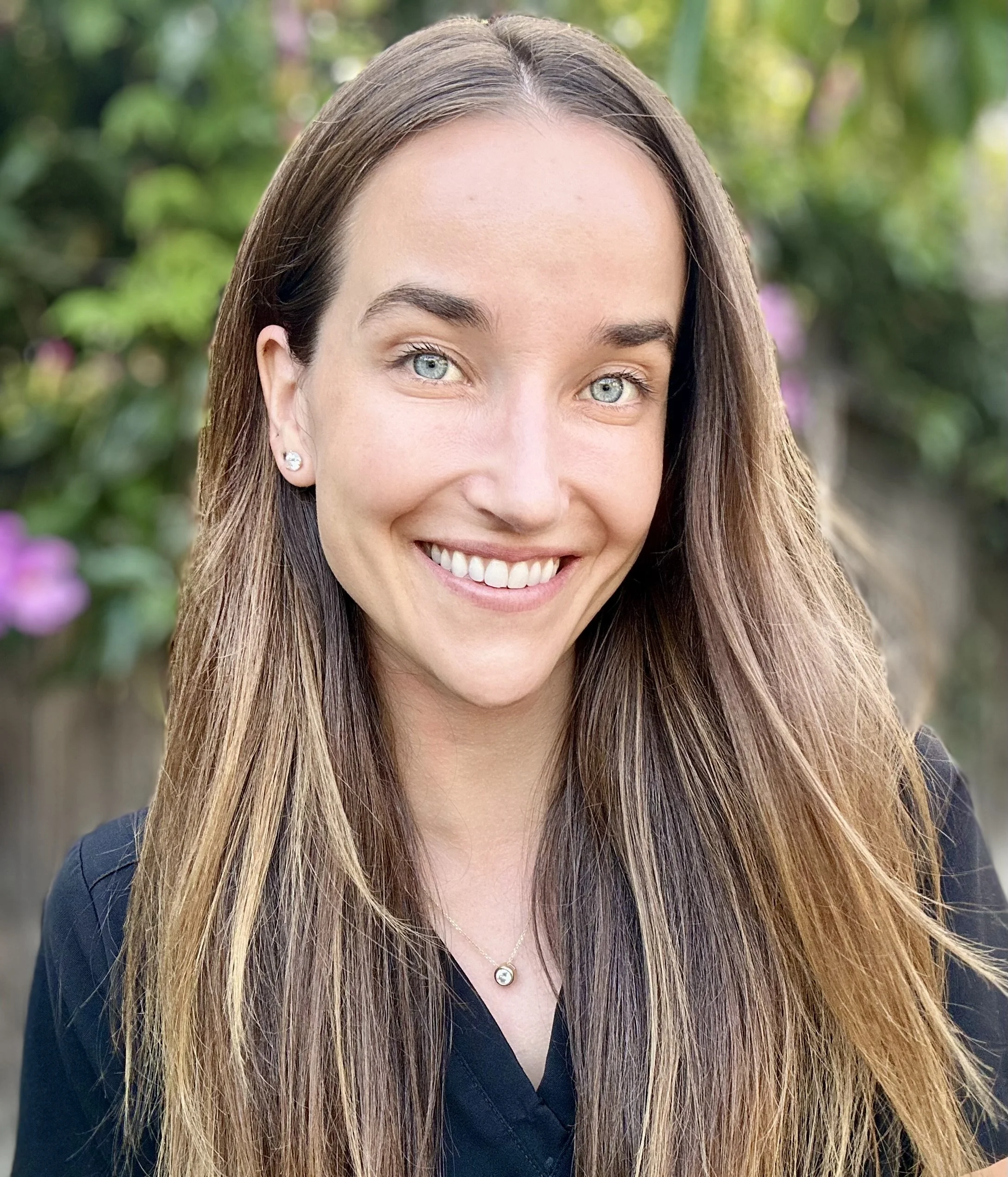 Portrait of the practice P.A. Courtney Paxson smiling into the camera