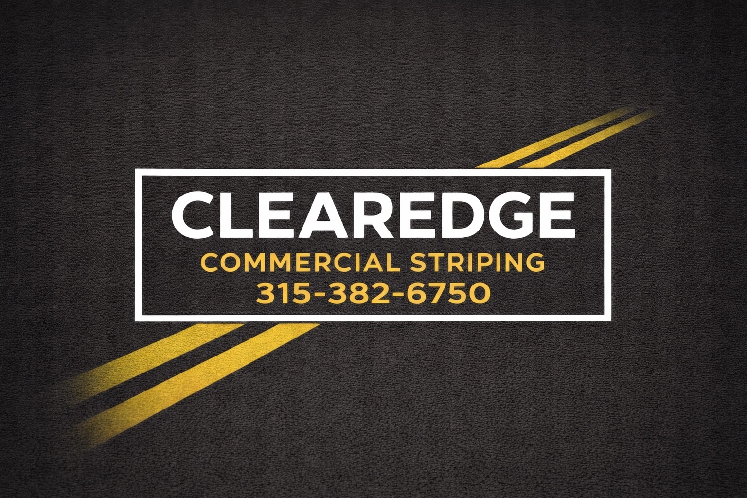 Clearedge commercial striping logo on top of an asphalt road with a double yellow solid road line. Phone number is listed for contact 315-382-6750