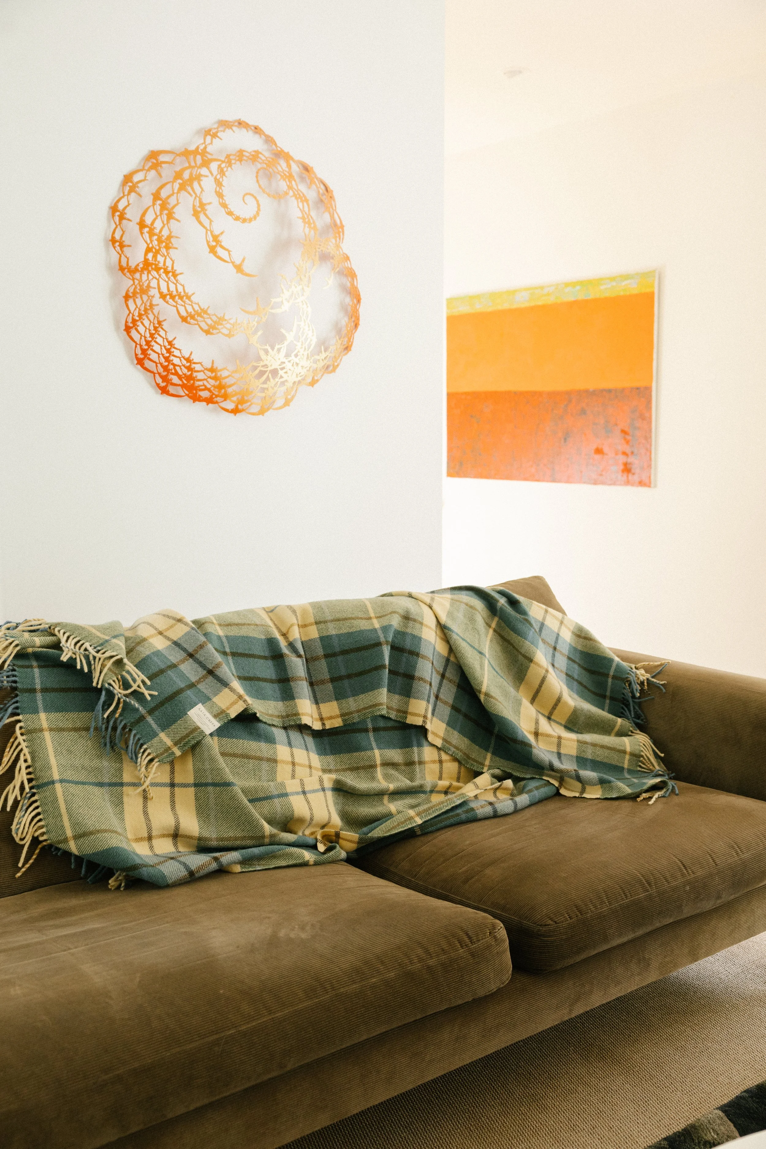 Rātā Creek Waikato tartan on back of long couch.jpg