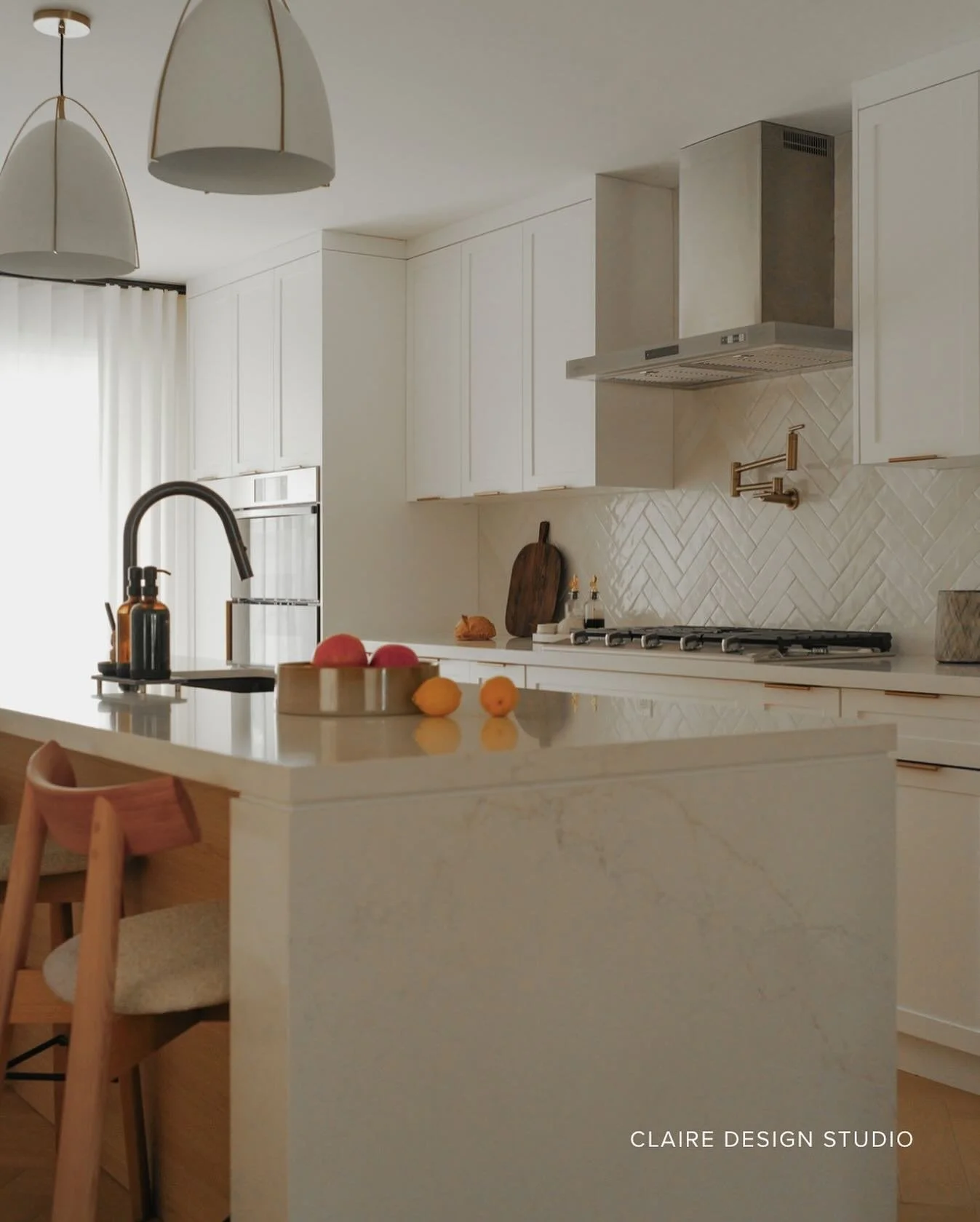 Kept it calm, warm, and quietly structured.
Ripple tile laid on the diagonal to catch the light, warm wood for grounding, and a Venetian Bronze faucet to anchor the palette.
Not a statement kitchen &mdash; just one that stays.

#kitchendesign #toront