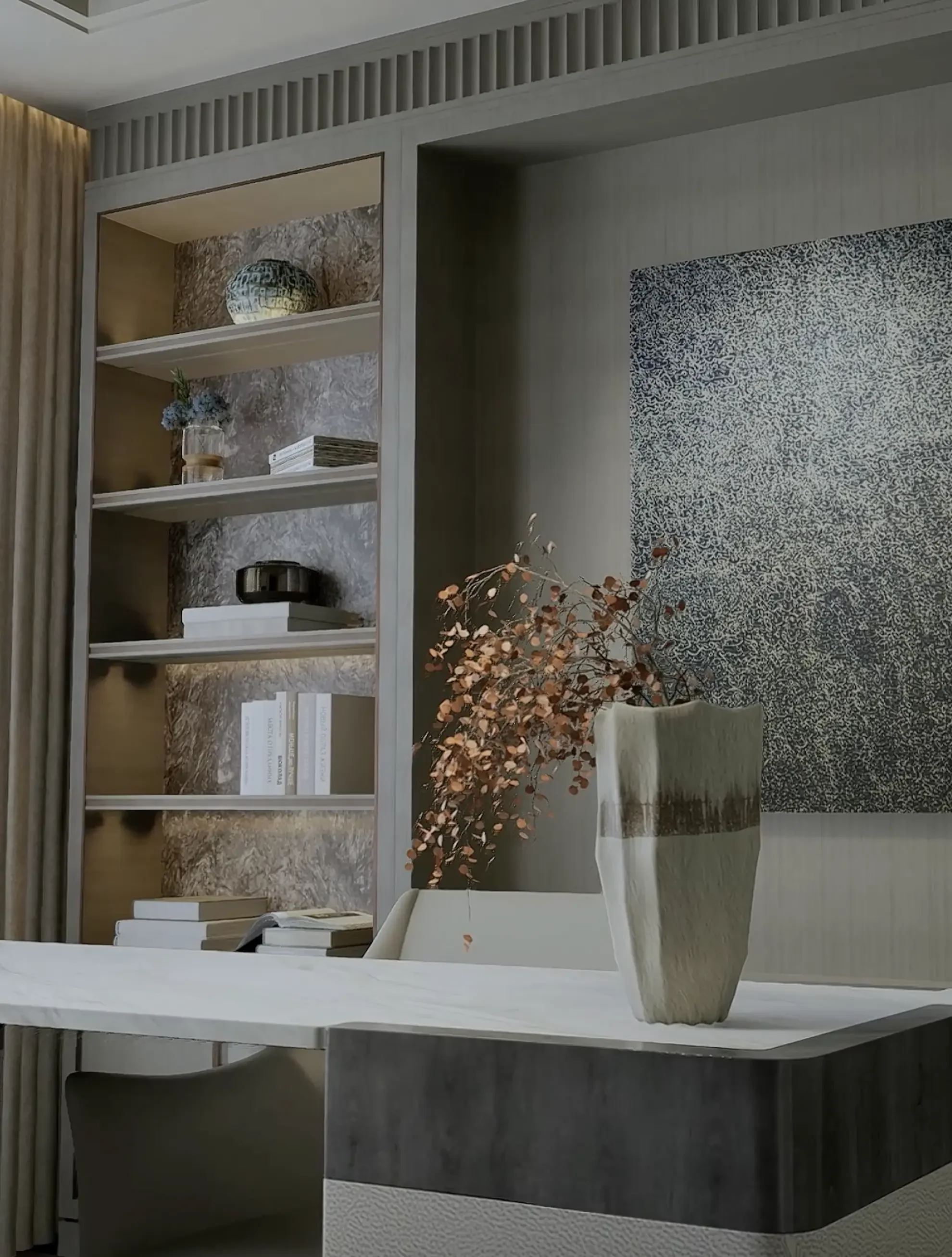 Detail view of a modern executive office by Claire Design Studio in Toronto, featuring integrated library shelving with marble backpanels, a textured stone-top desk, and sophisticated interior styling with artisanal vases.