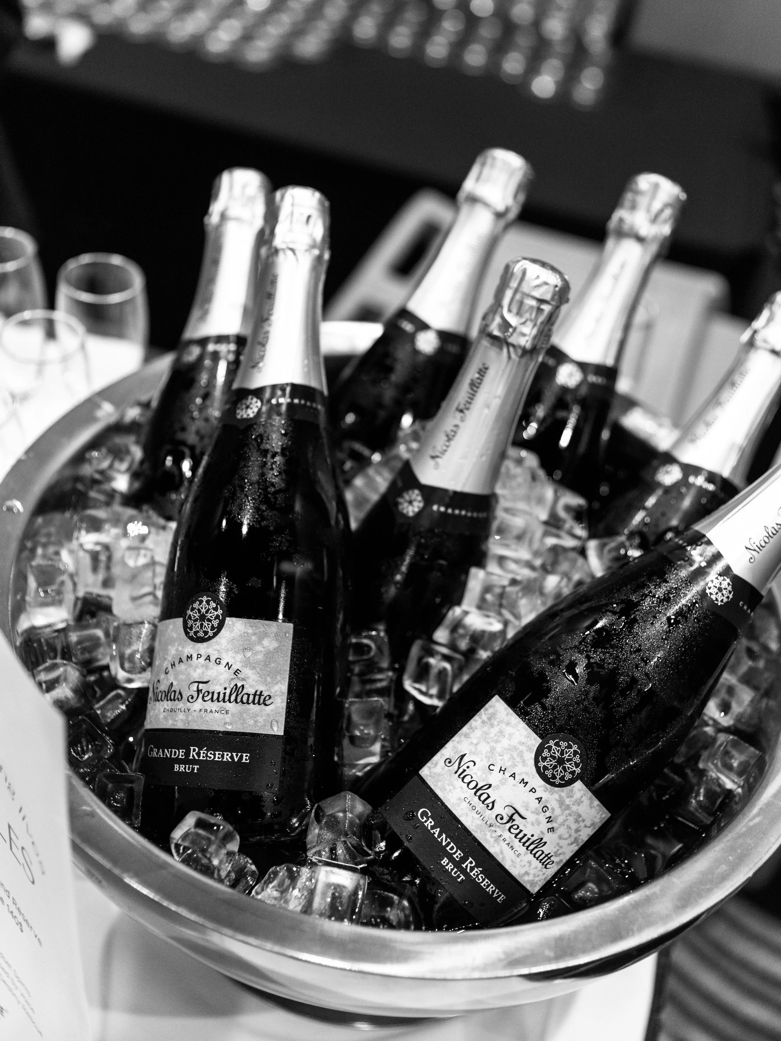 Close-up of Nicolas Feuillatte champagne bottles on ice.