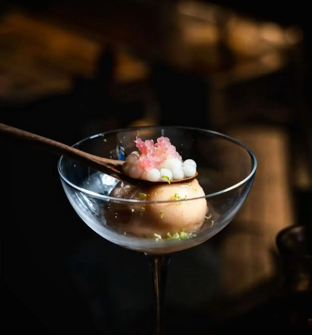 Sgroppino cocktail with mango and saffron sorber, finger lime, lemon bobba pearls