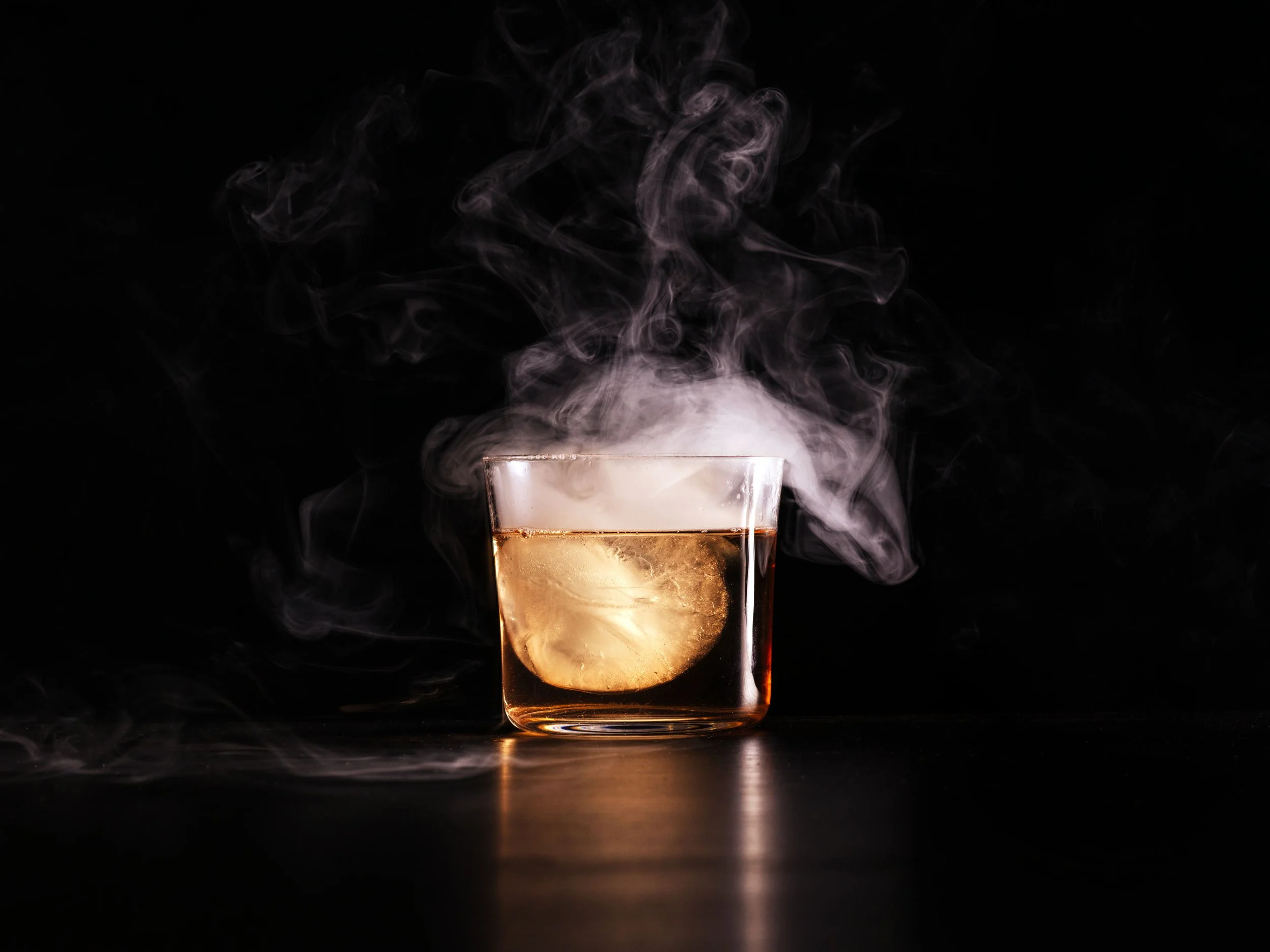 Dk Old Fashioned with smoke coming out of the glass at Magma restaurant