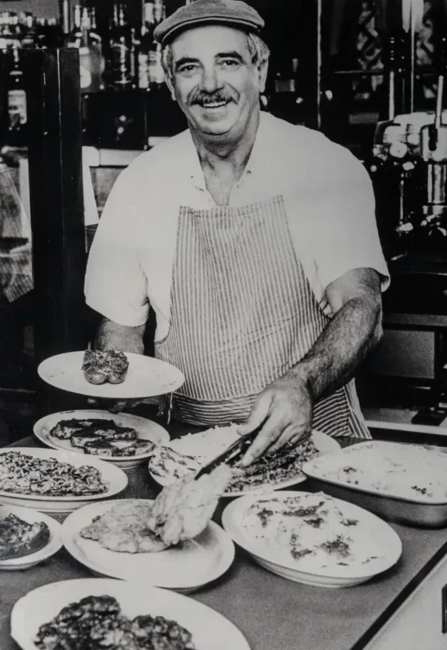 Emilio serving food at emilio's restaurant