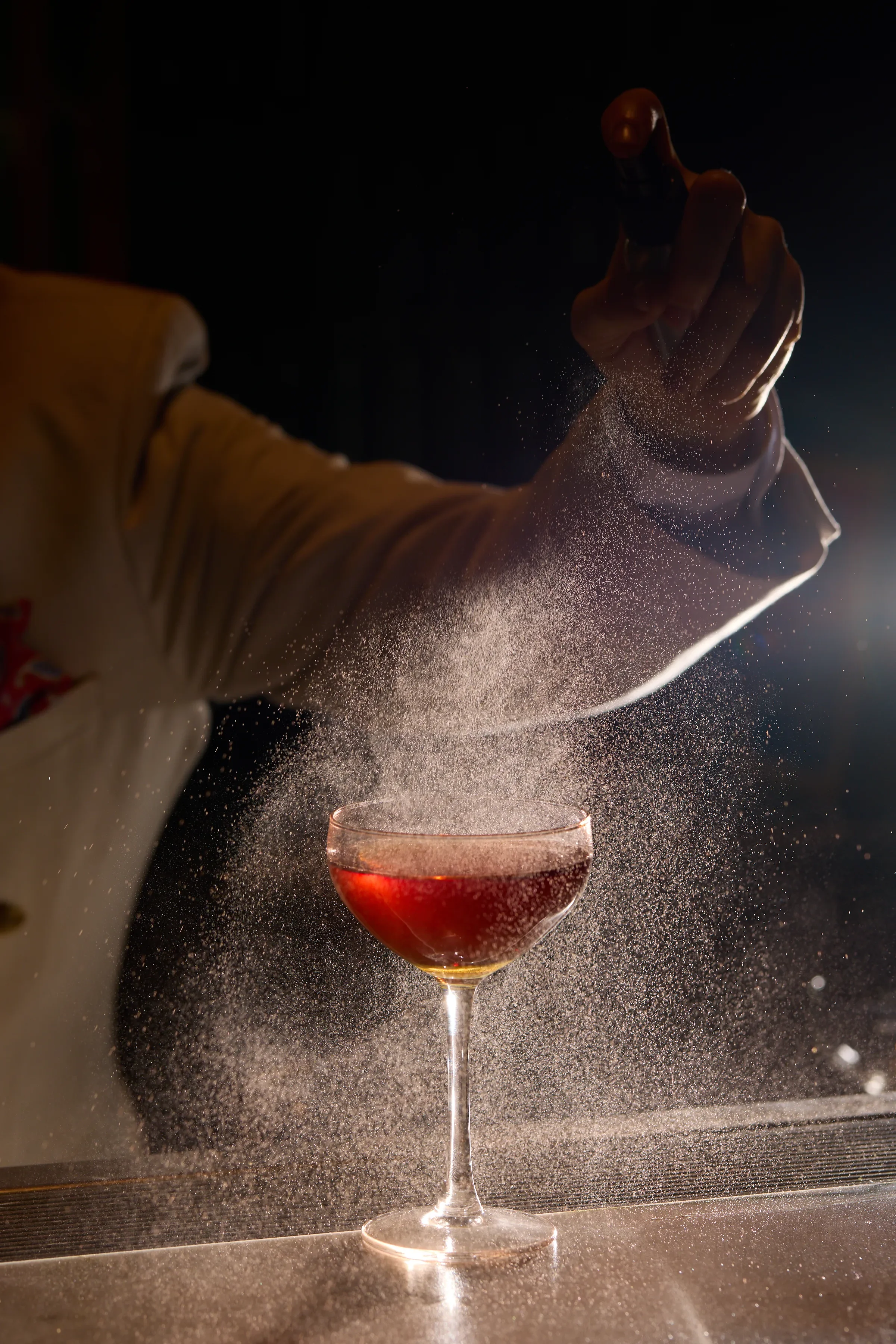 Mist spray over cocktail at Lotus bar 