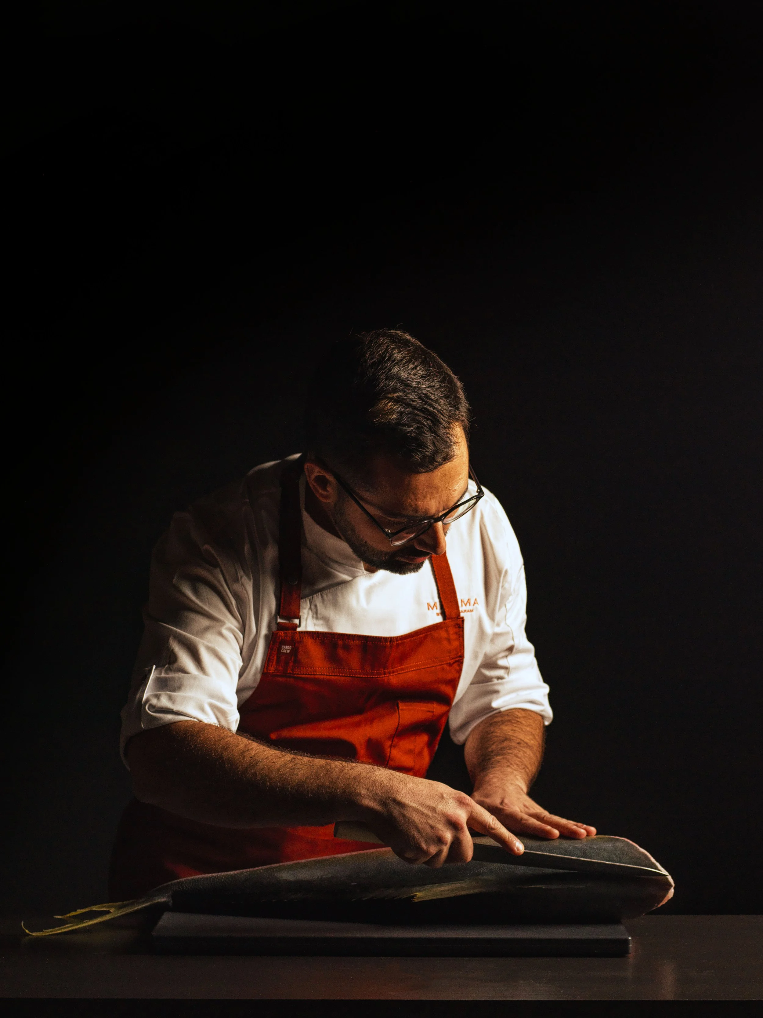 Sebastian Geray Executive chef of Magma slicing a premium steak