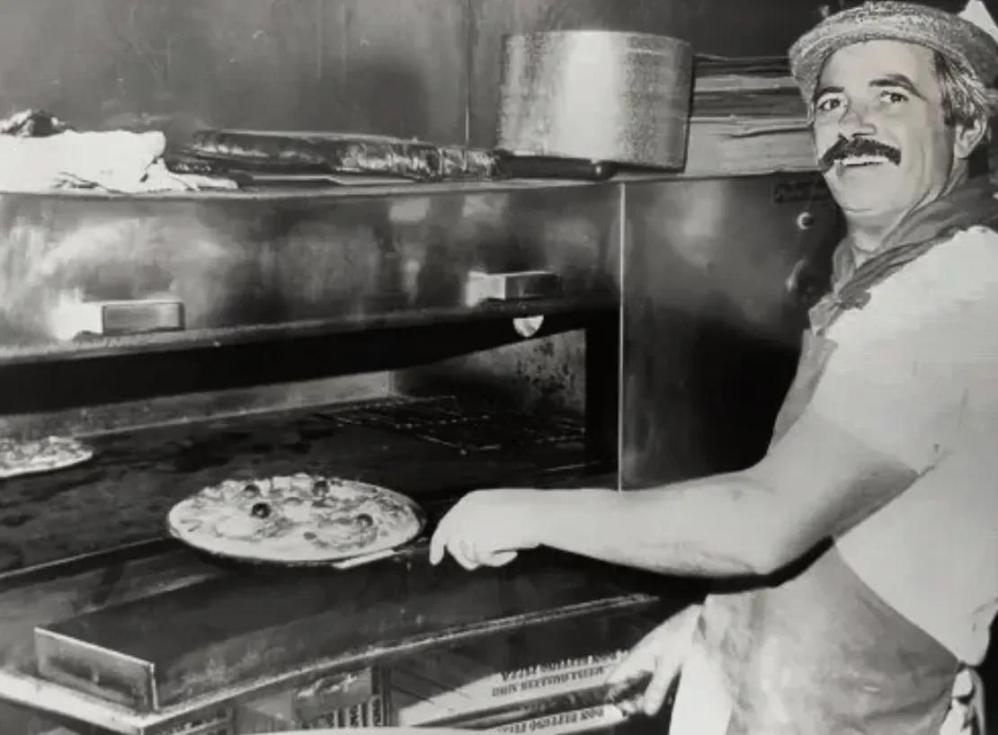 Emilio making a pizza at emilio's restaurant