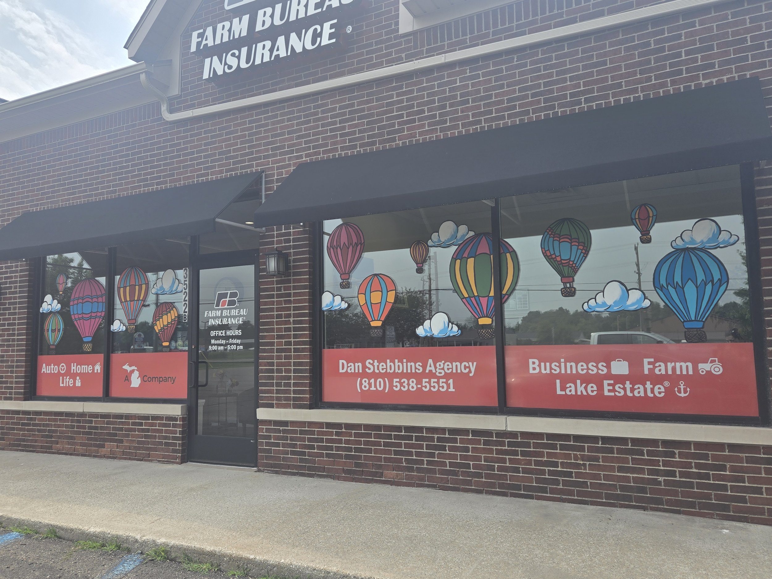 Hot air balloon window art at Metamora Farm Bureau.