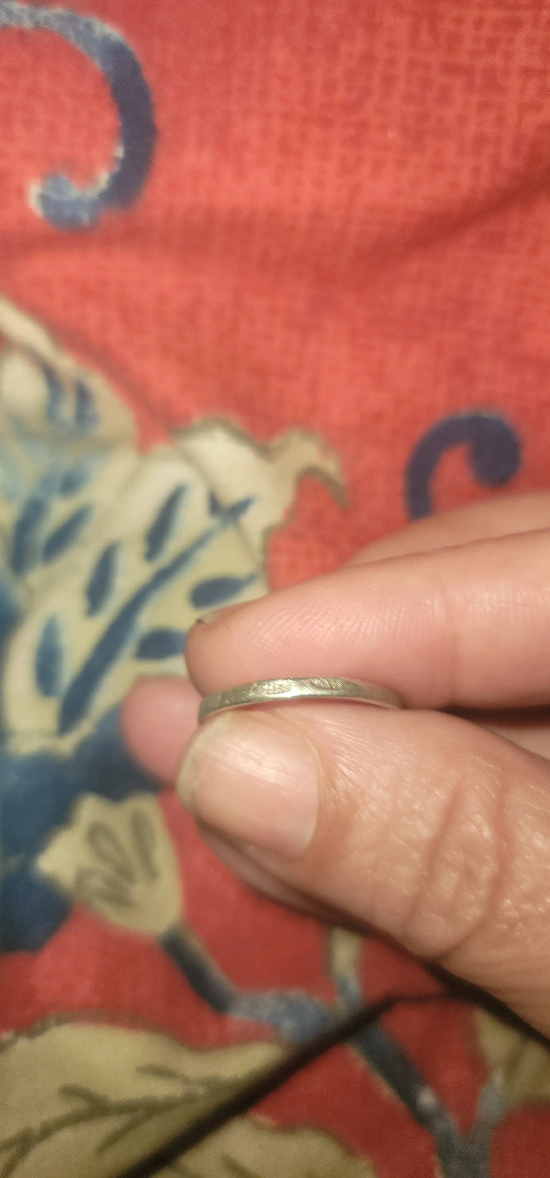 Close-up of the ring's band, showing the faint marks on the silver