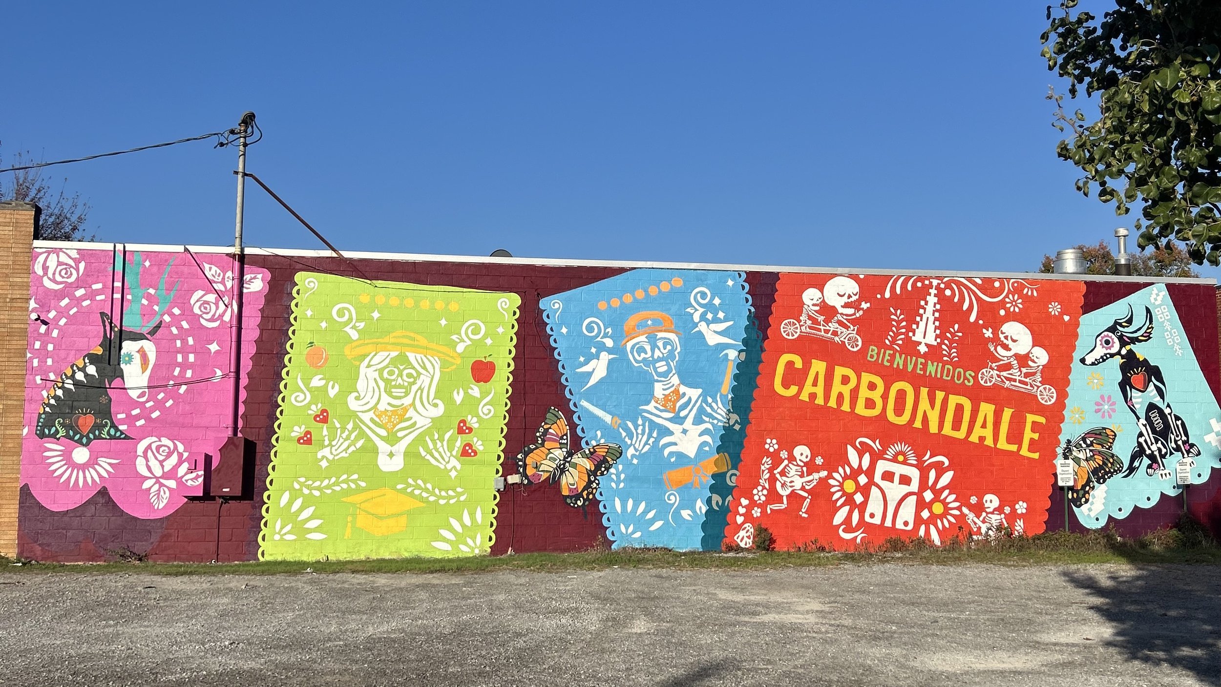 Celebrating the Day of the Dead Mural in Southern Illinois nonprofit community arts mural project, independent artists, Carbondale, IL titled Bienvenidos Carbondale.