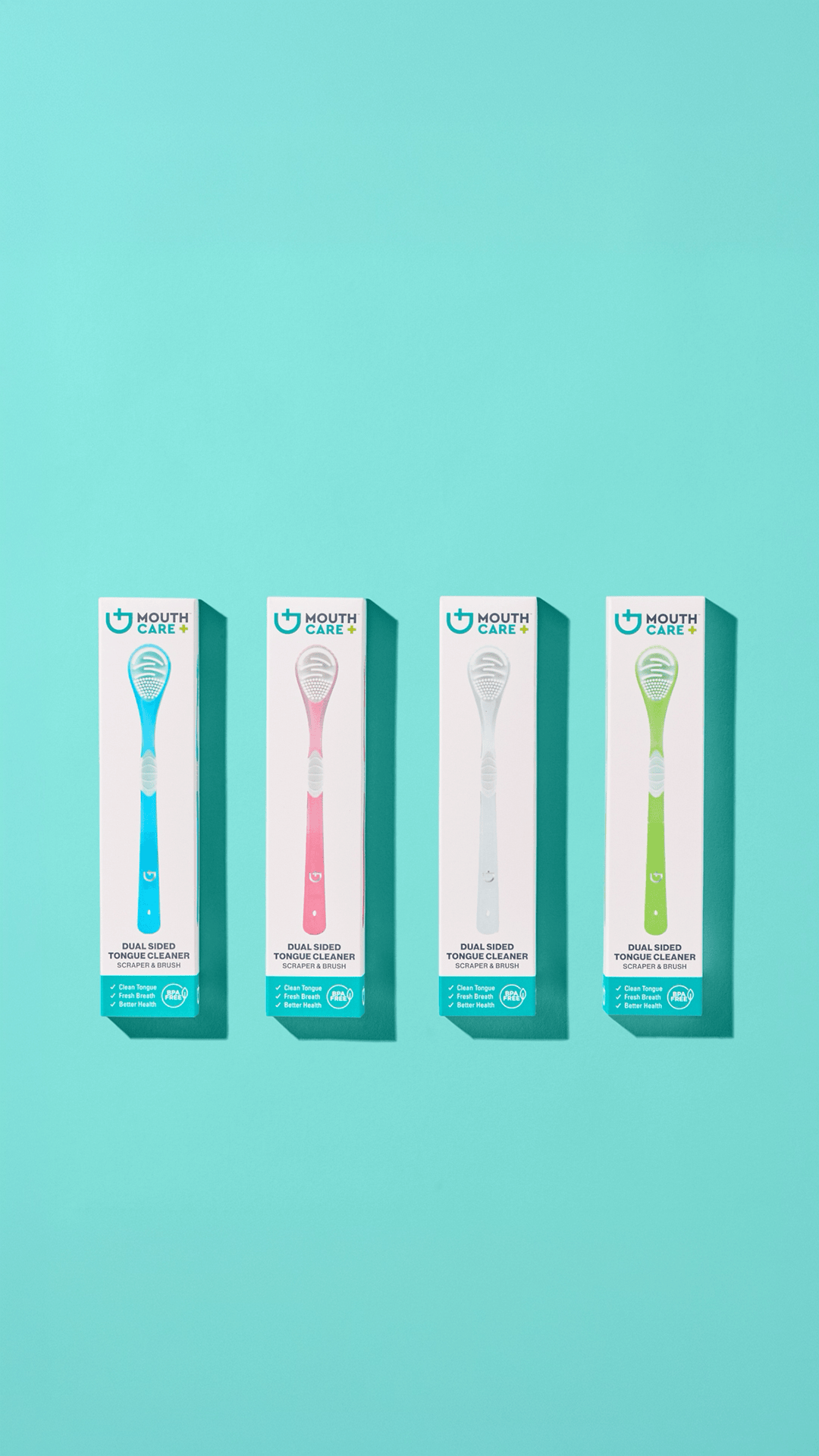 Four boxes of mouth care tongue cleaners in blue, pink, white, and green, aligned against a teal background.