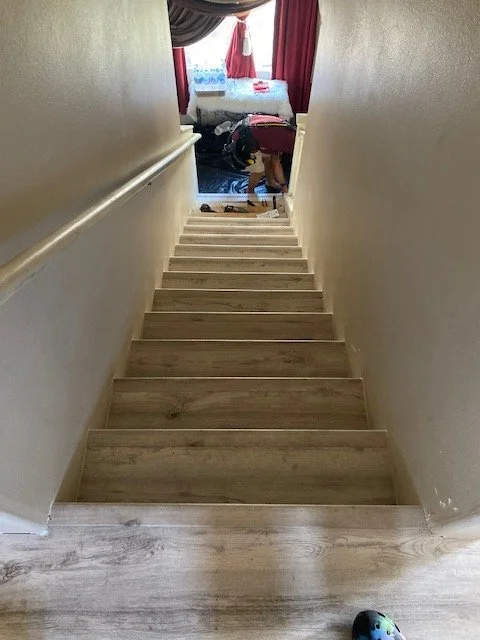 Replaced carpet on stairs with woodgrain luxury vinyl plank and bullnose edge