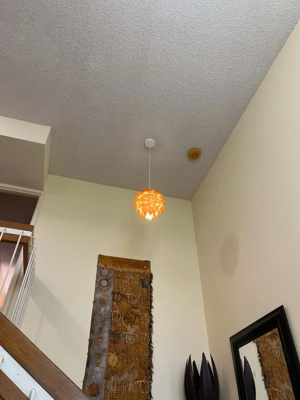 Installed pendant light over staircase