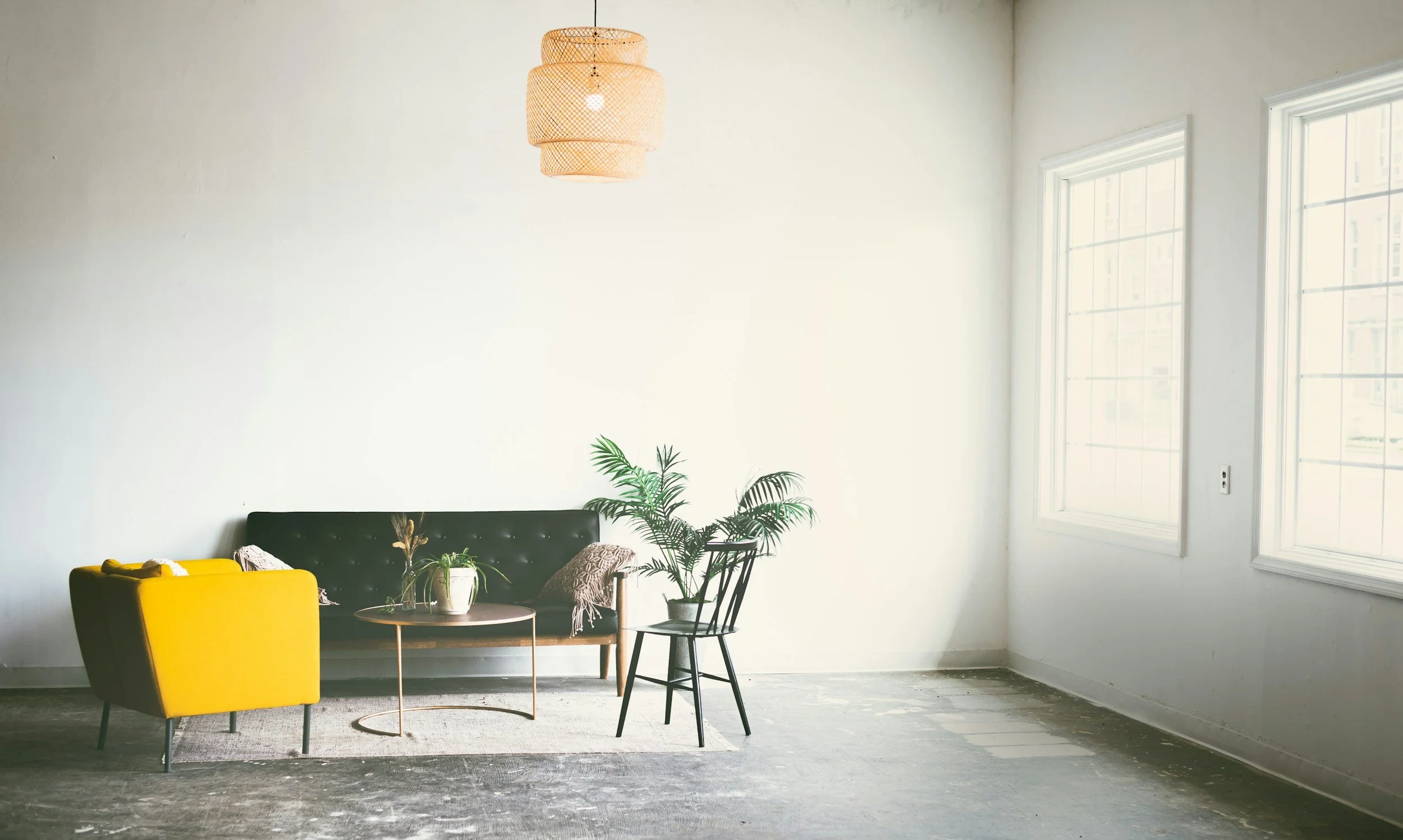 Empty sofa featuring a cozy office