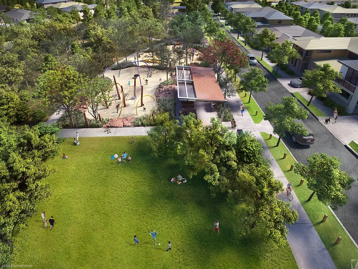 An aerial view of a community park featuring a playground with swings and climbing structures, a grassy area with children playing, and a surrounding neighborhood with houses, trees, and parked cars.