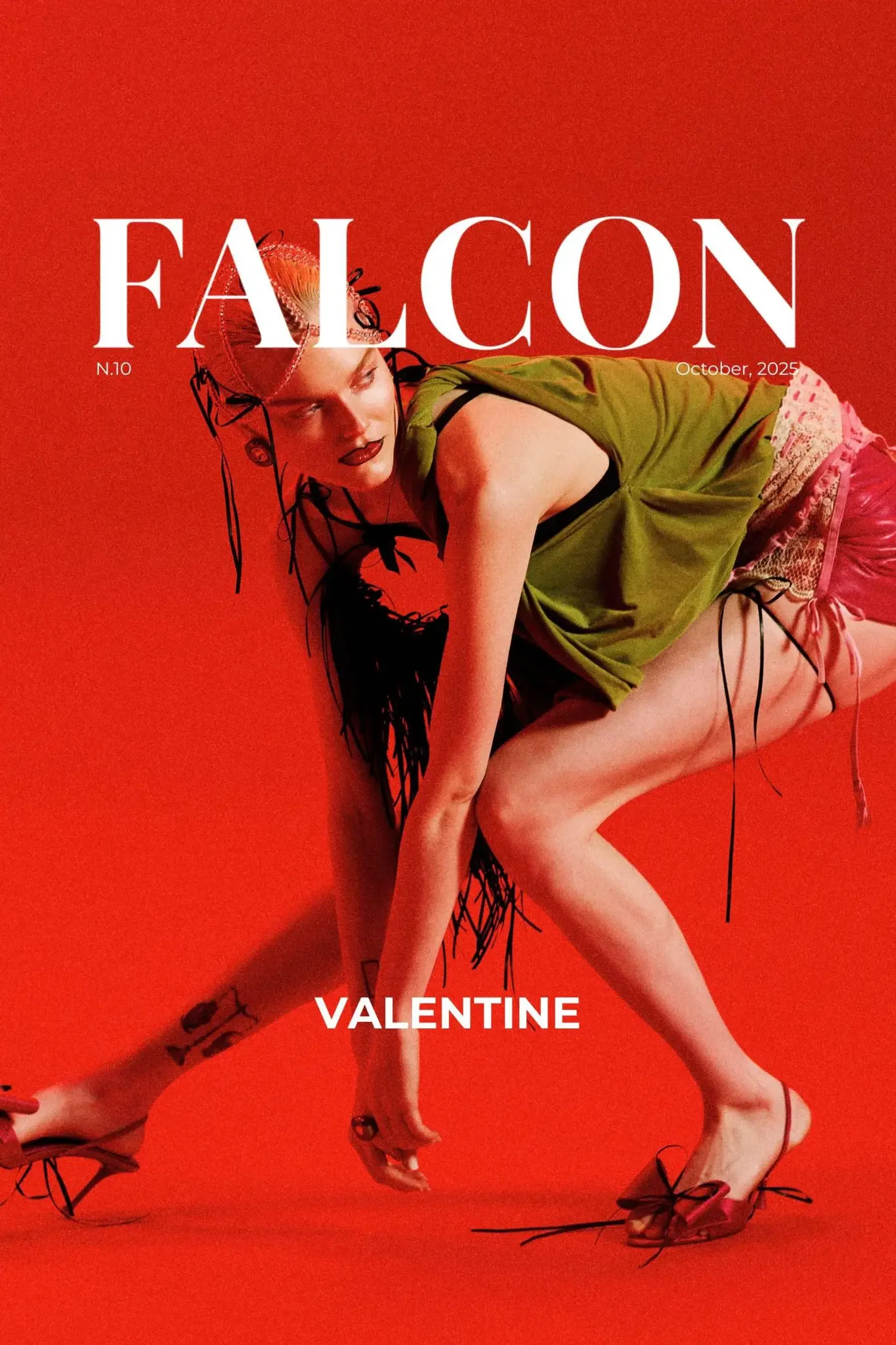 Magazine cover with a woman in a green dress and red shoes on a red background. The woman is in a squatting pose, with black and red accessories, and has red hair styled in a braid. The magazine title is 'FALCON,' and the issue is 'October, 2025,' with a subtitle 'VALENTINE'.