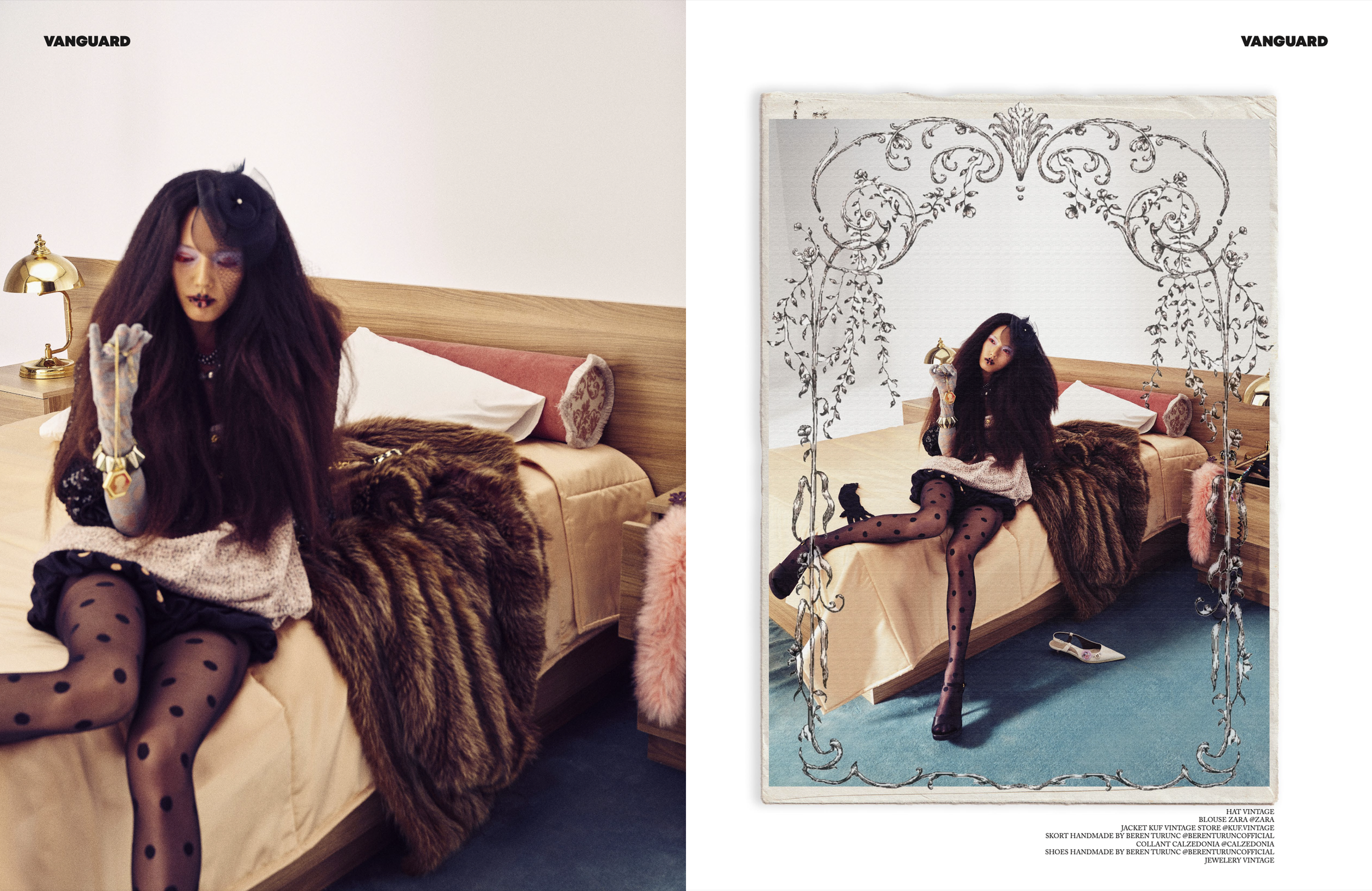 A woman with long dark hair wearing a vintage hat, jacket, skirt, and polka dot tights, sitting on a bed with fur blanket in a bedroom with a white wall and metallic lamp.