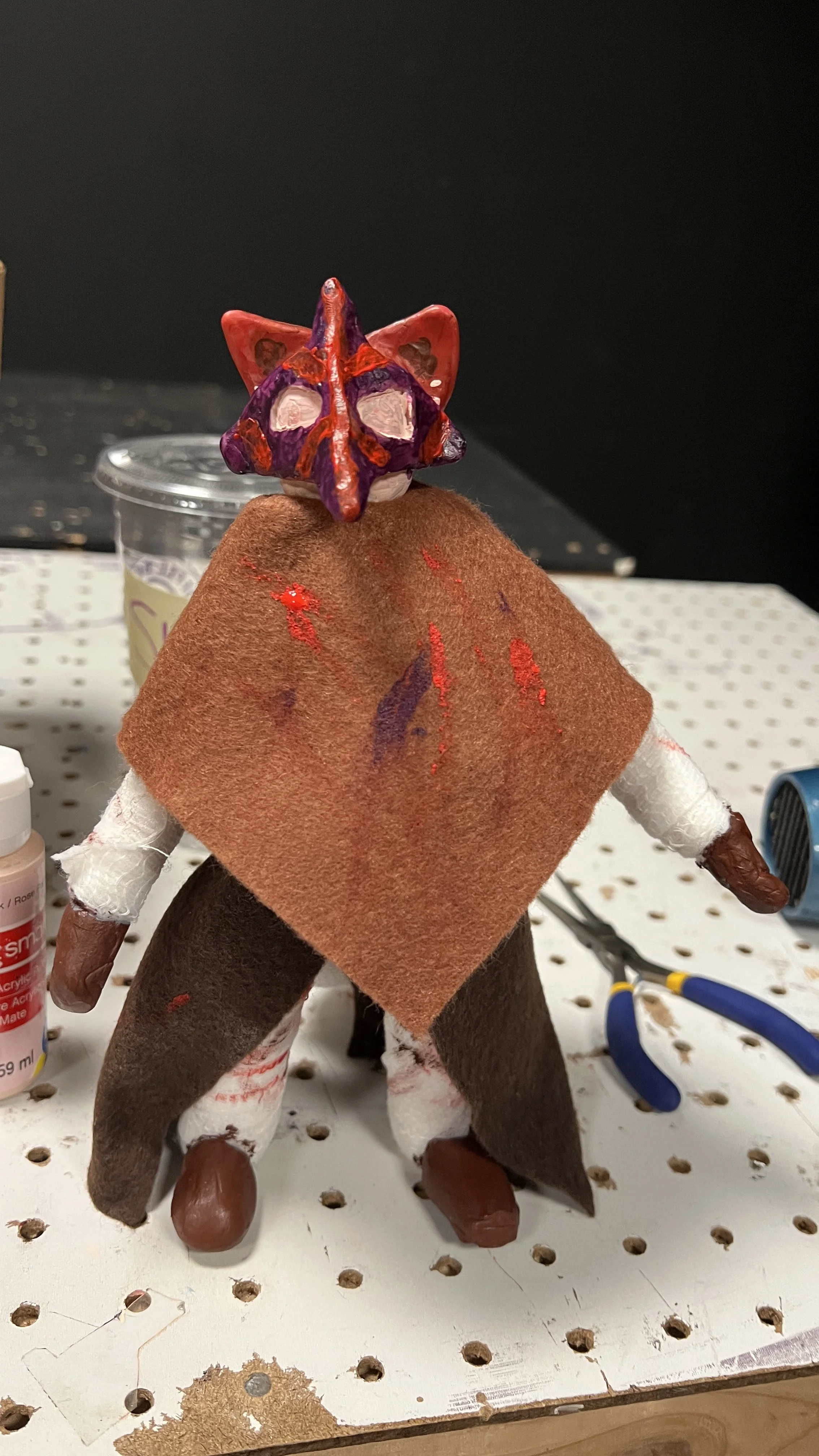Painted head put on, with extra touches on the poncho and body.