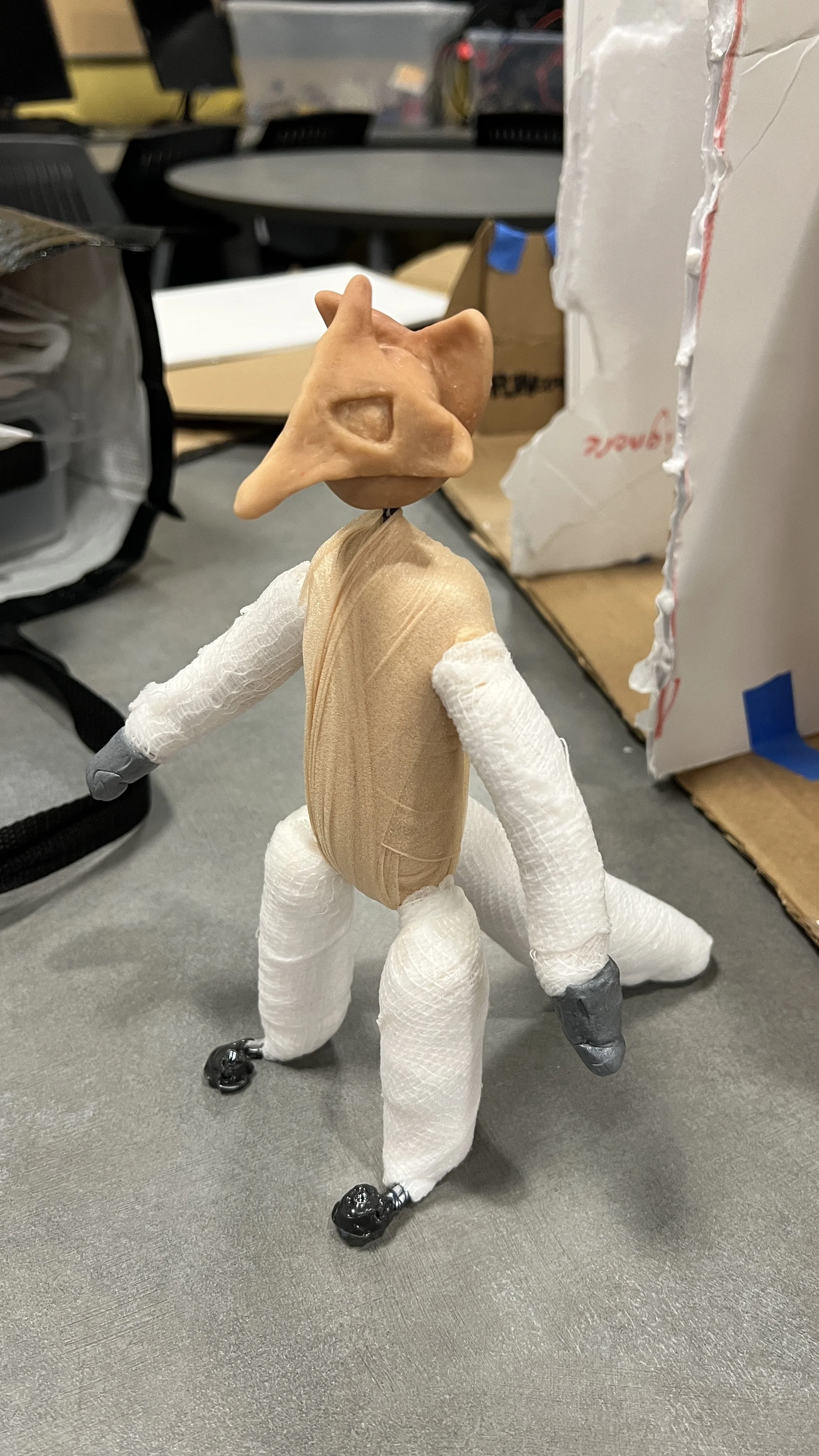 Body wrapped with gauze and head put on
