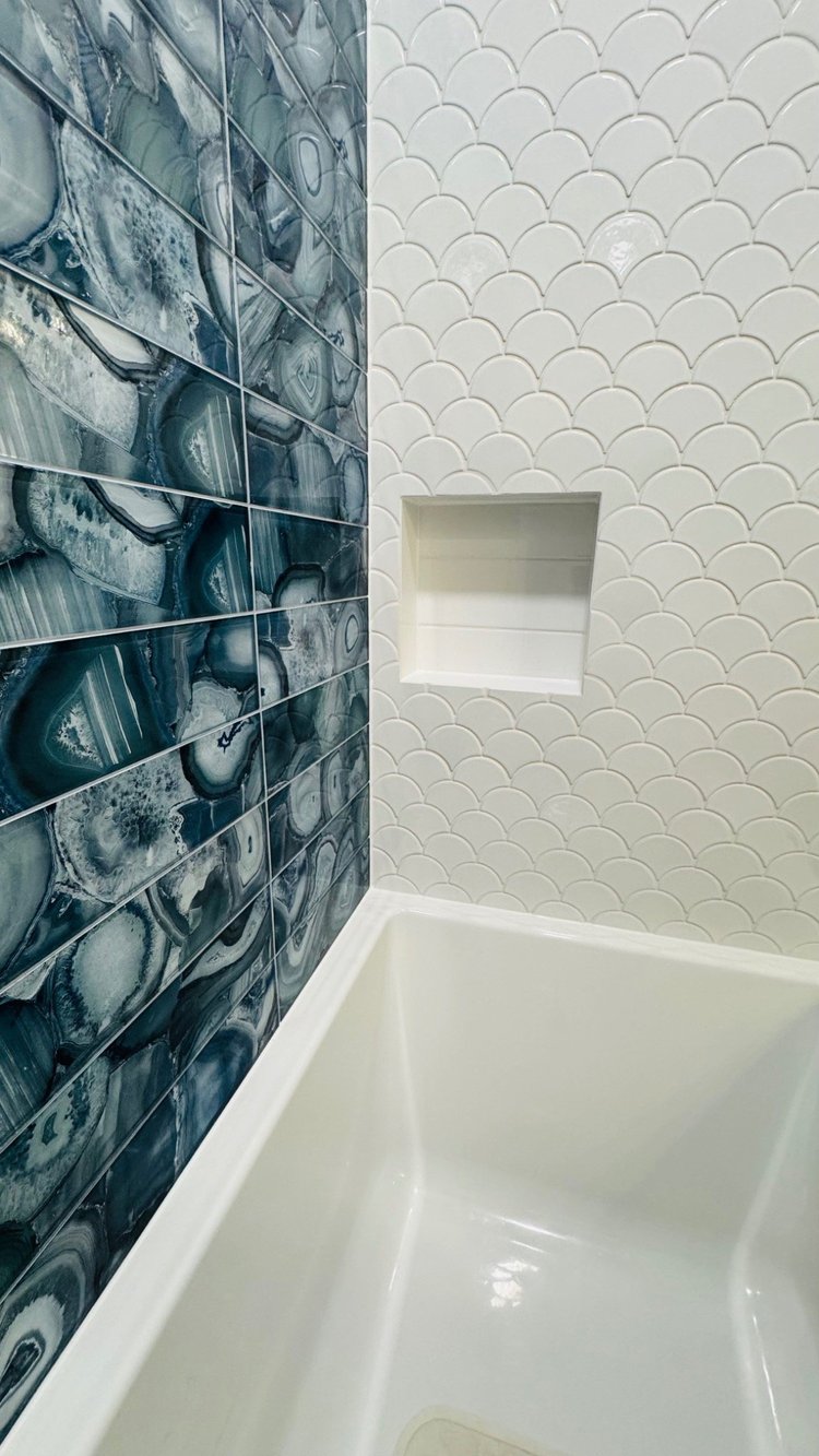 Mosaic tile bathtub surround and niche