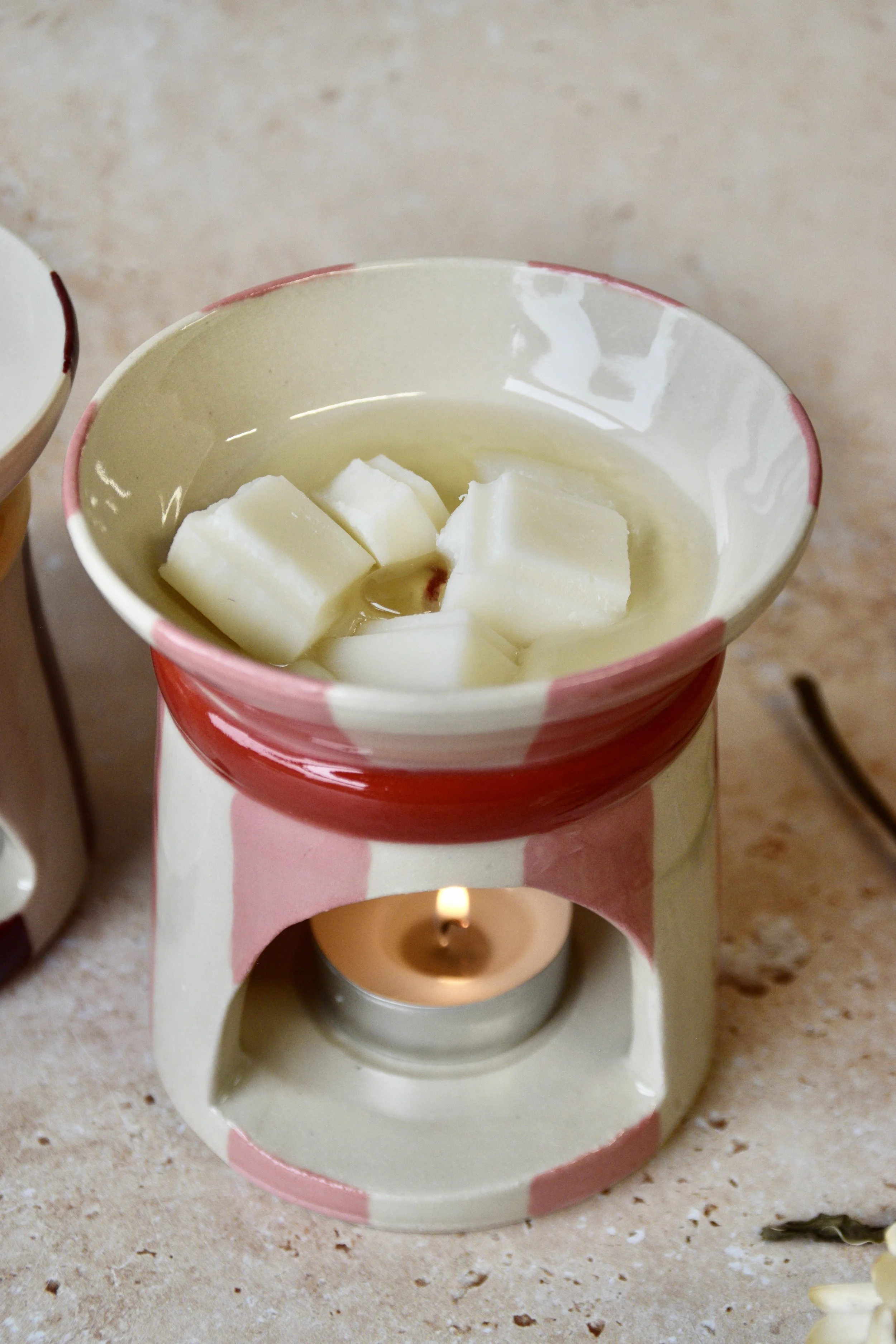 Pink and red ceramic wax burner melting wax