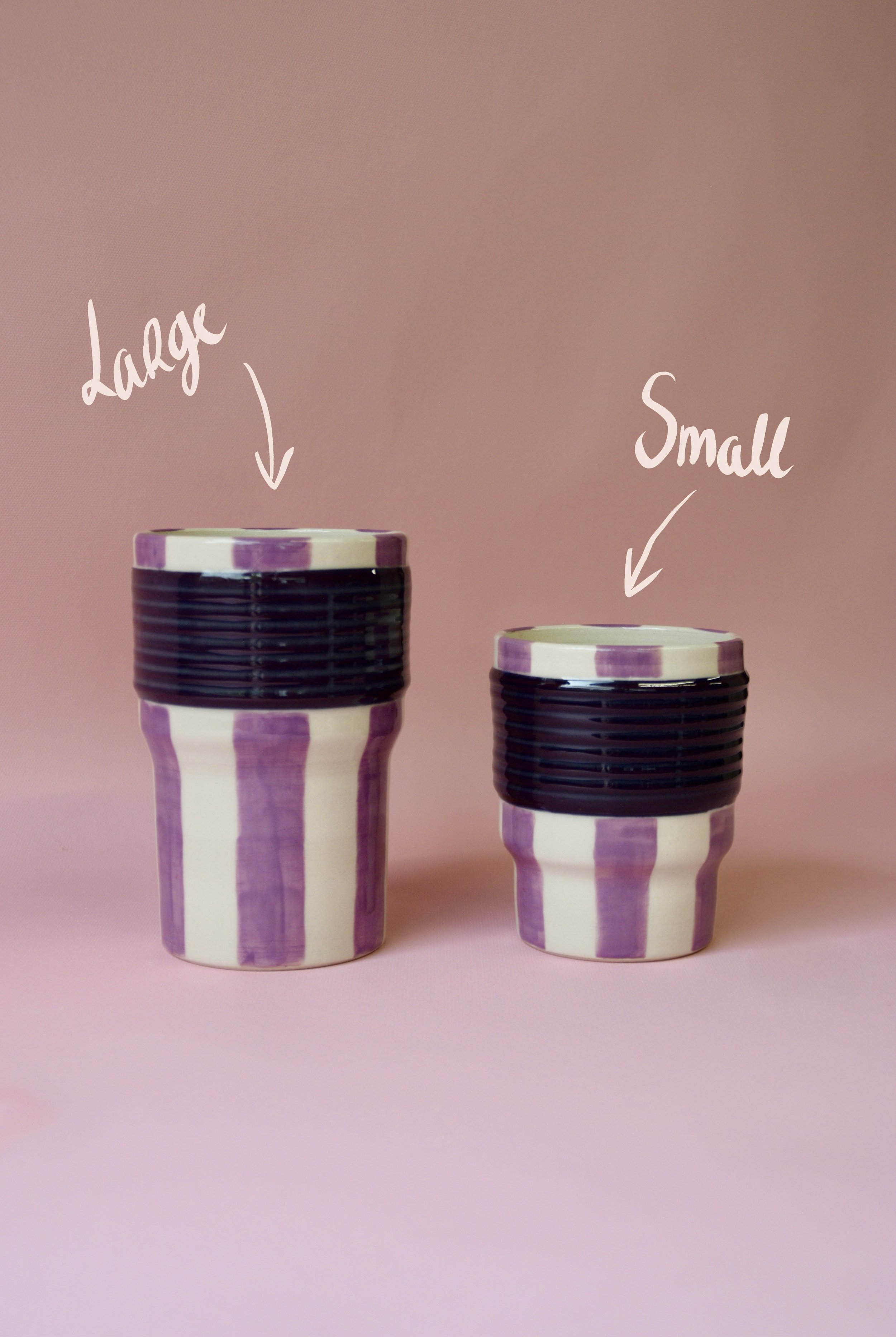 Large and small purple striped ceramic tumblers