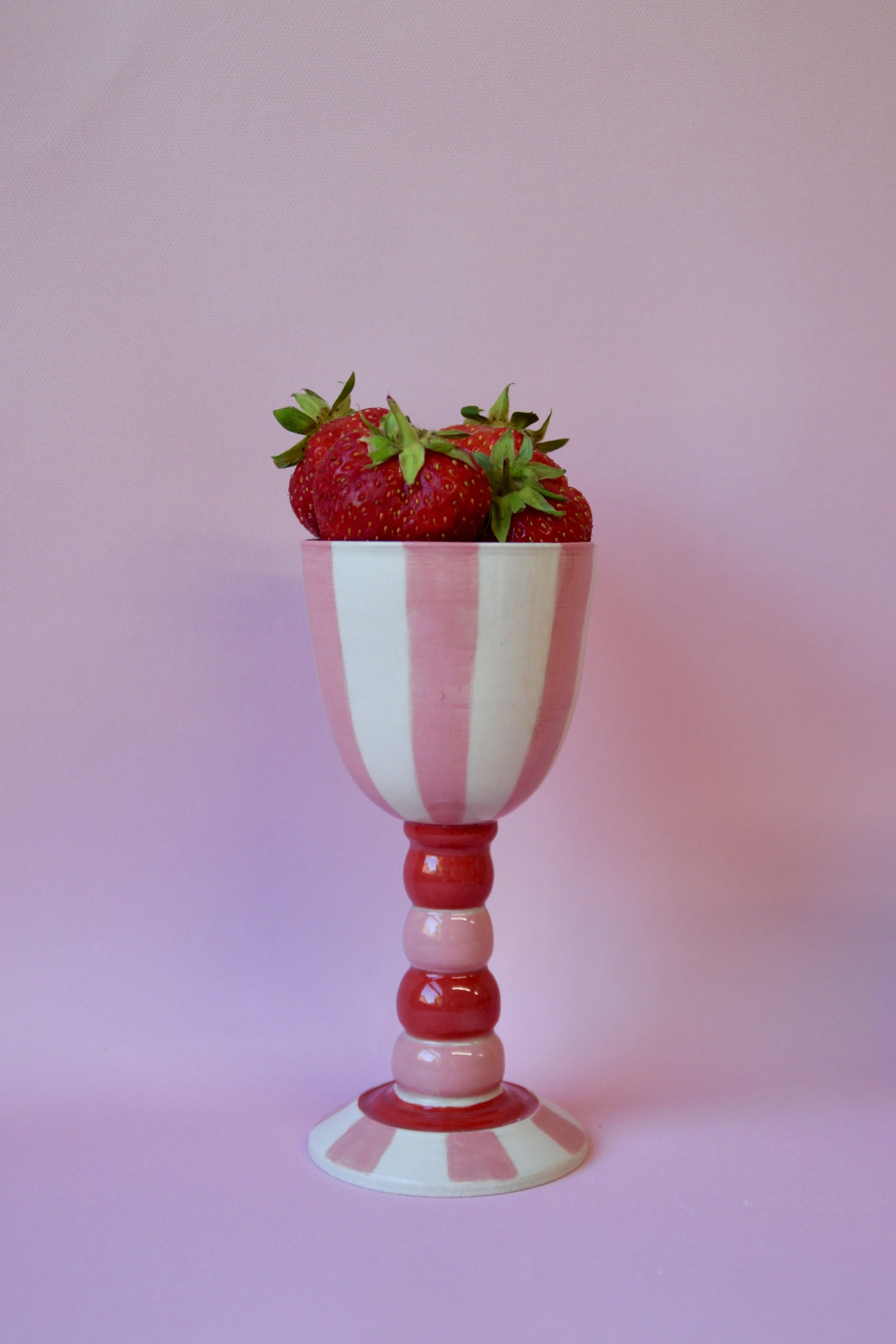 Pink striped ceramic goblet with strawberries
