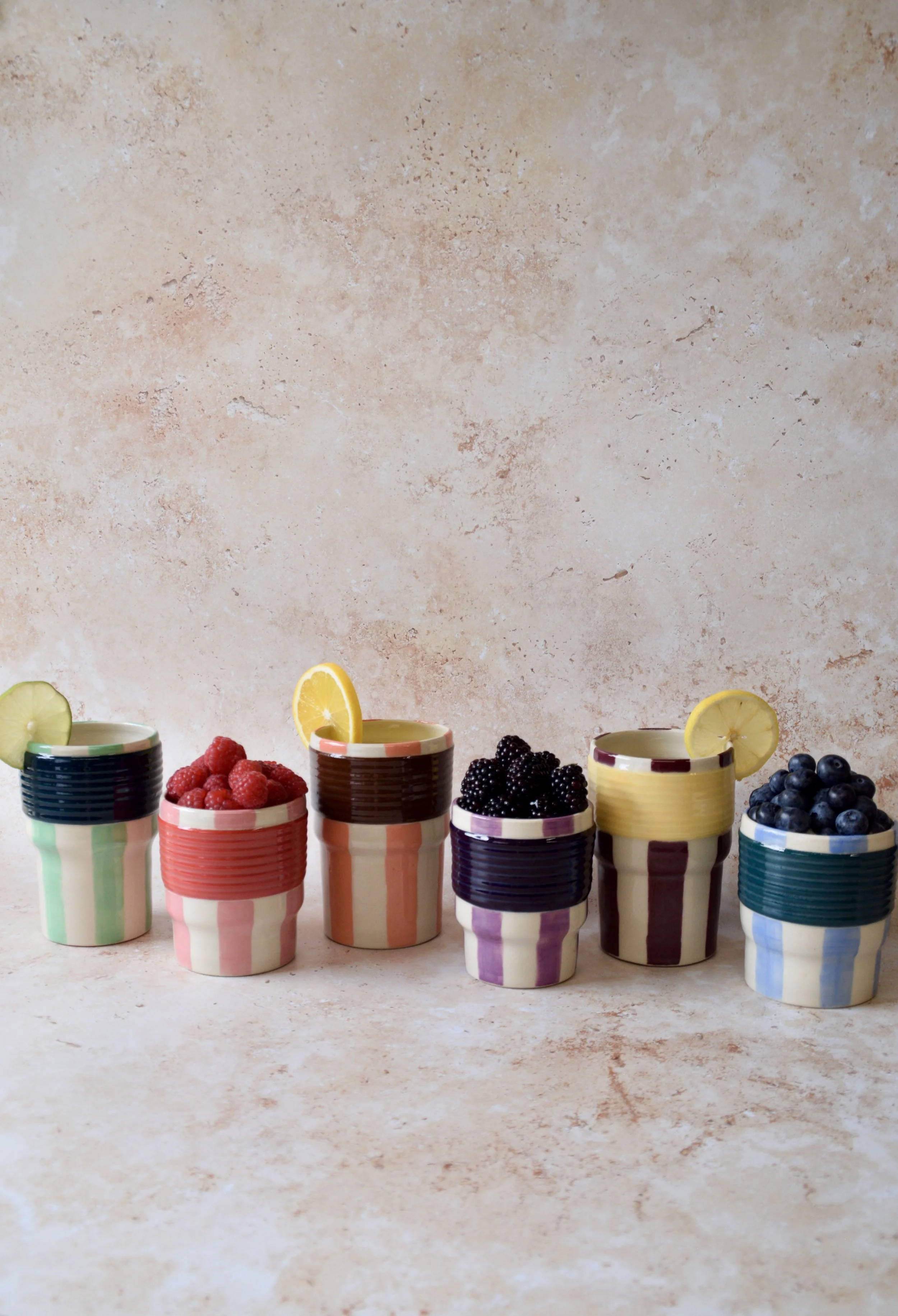 Handmade striped ceramic tumblers in different colourways