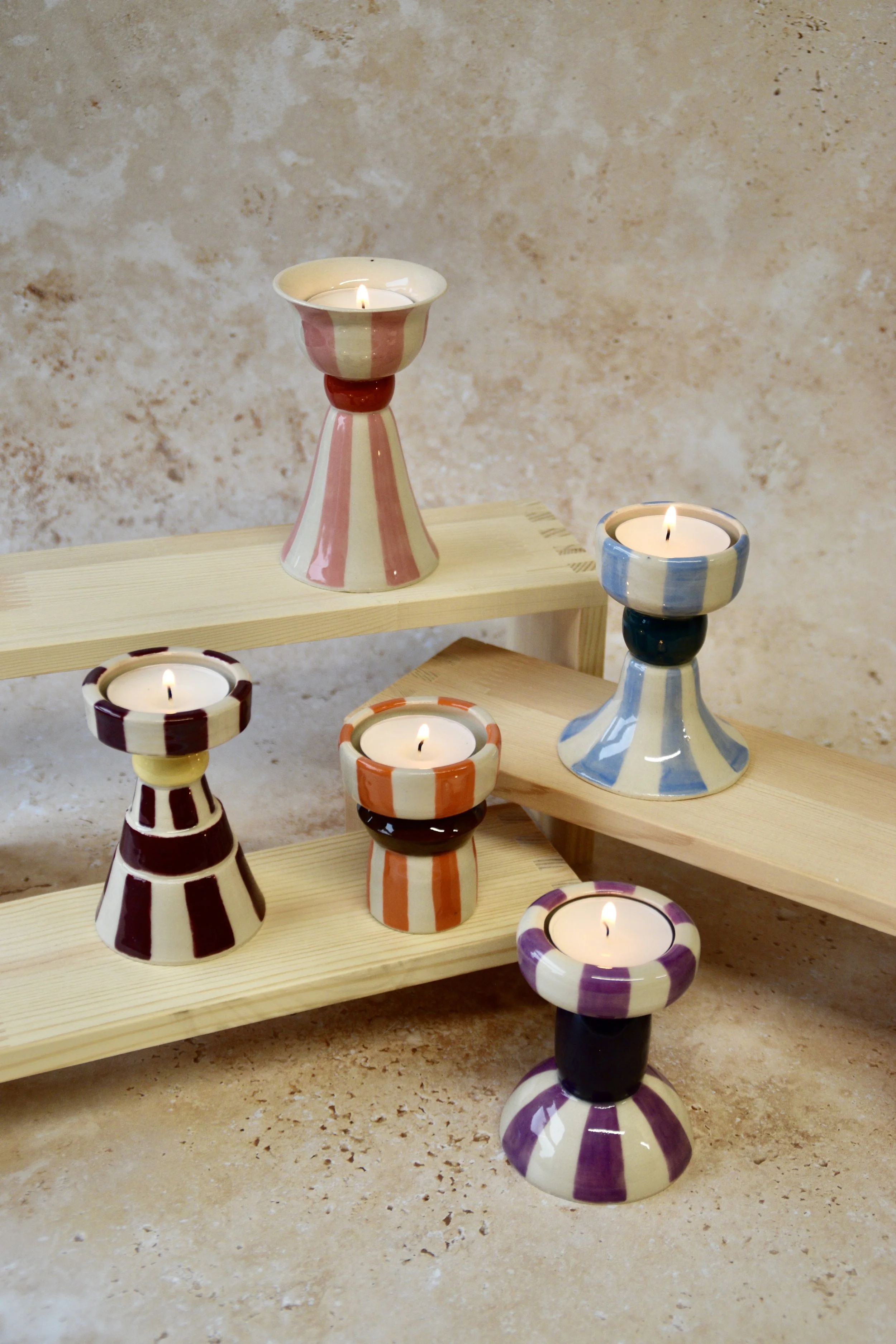 Collection of handmade striped ceramic tea light holders