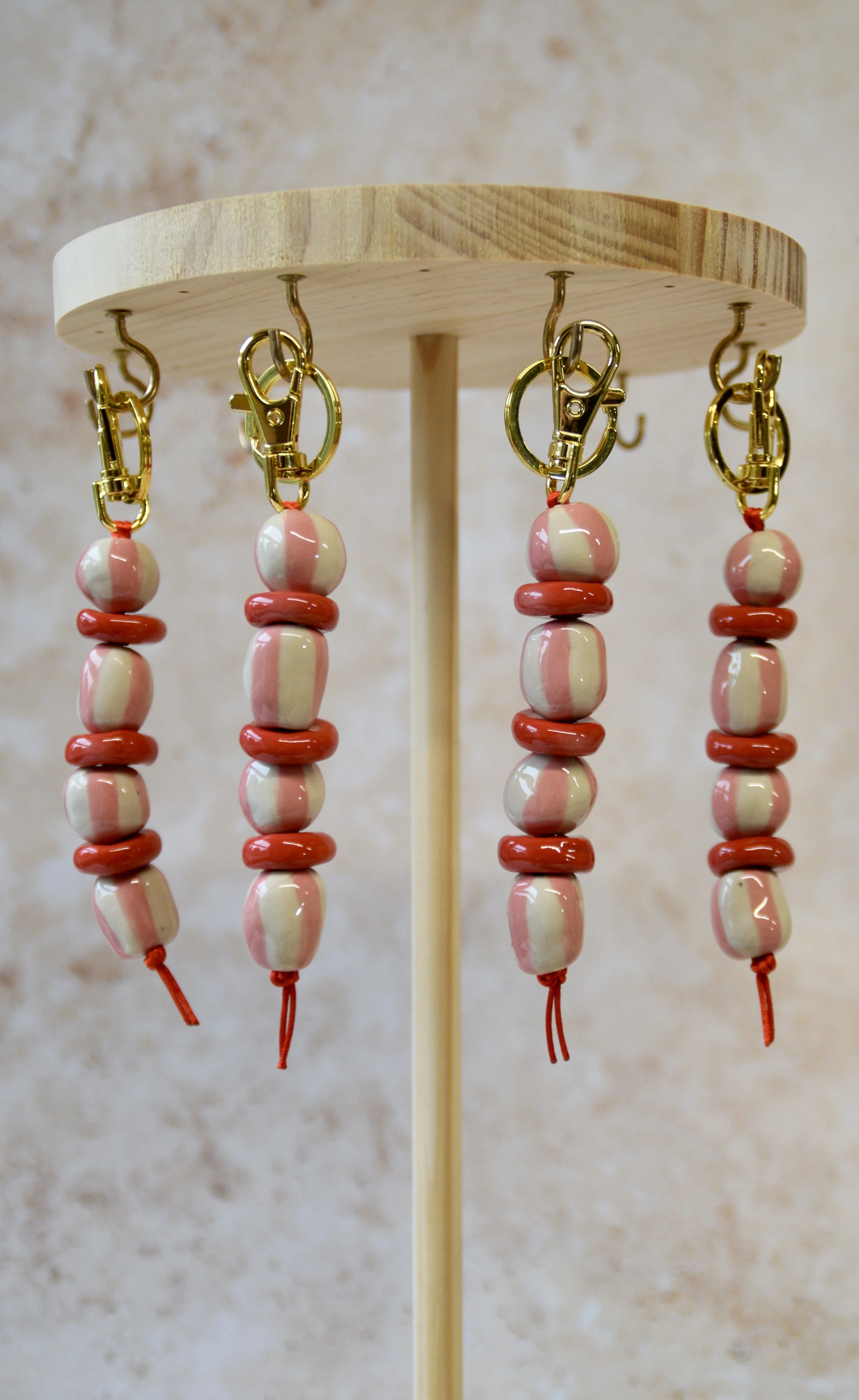 Pink and red ceramic bead bag charms