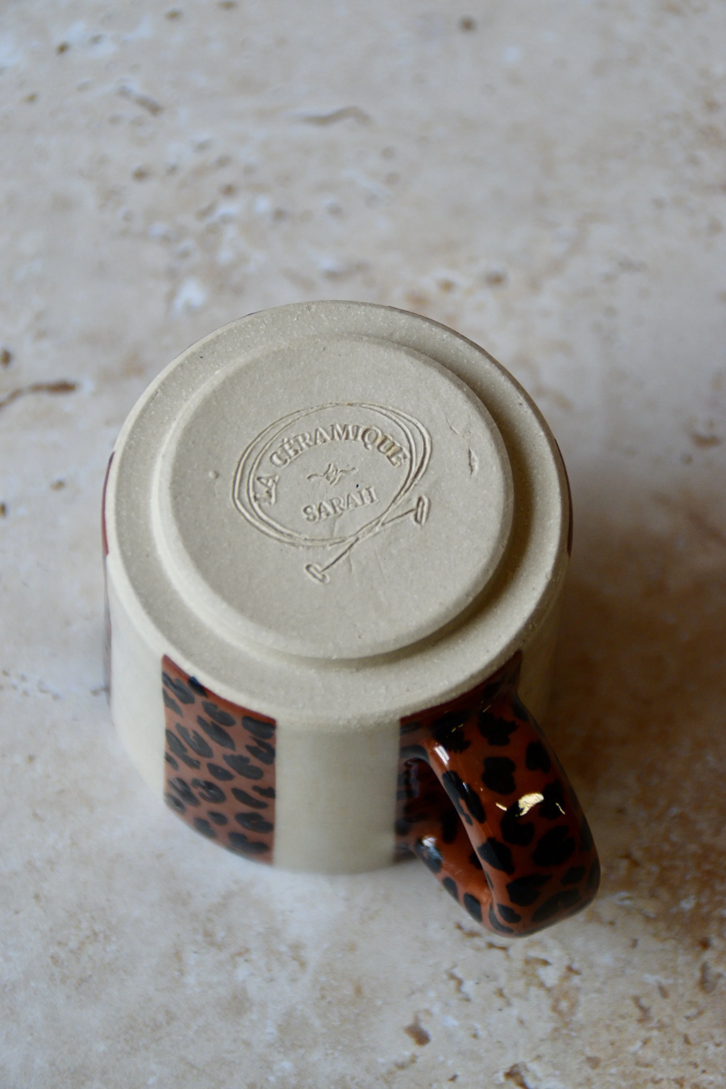 Bottom view of espresso cup in leopard stripes