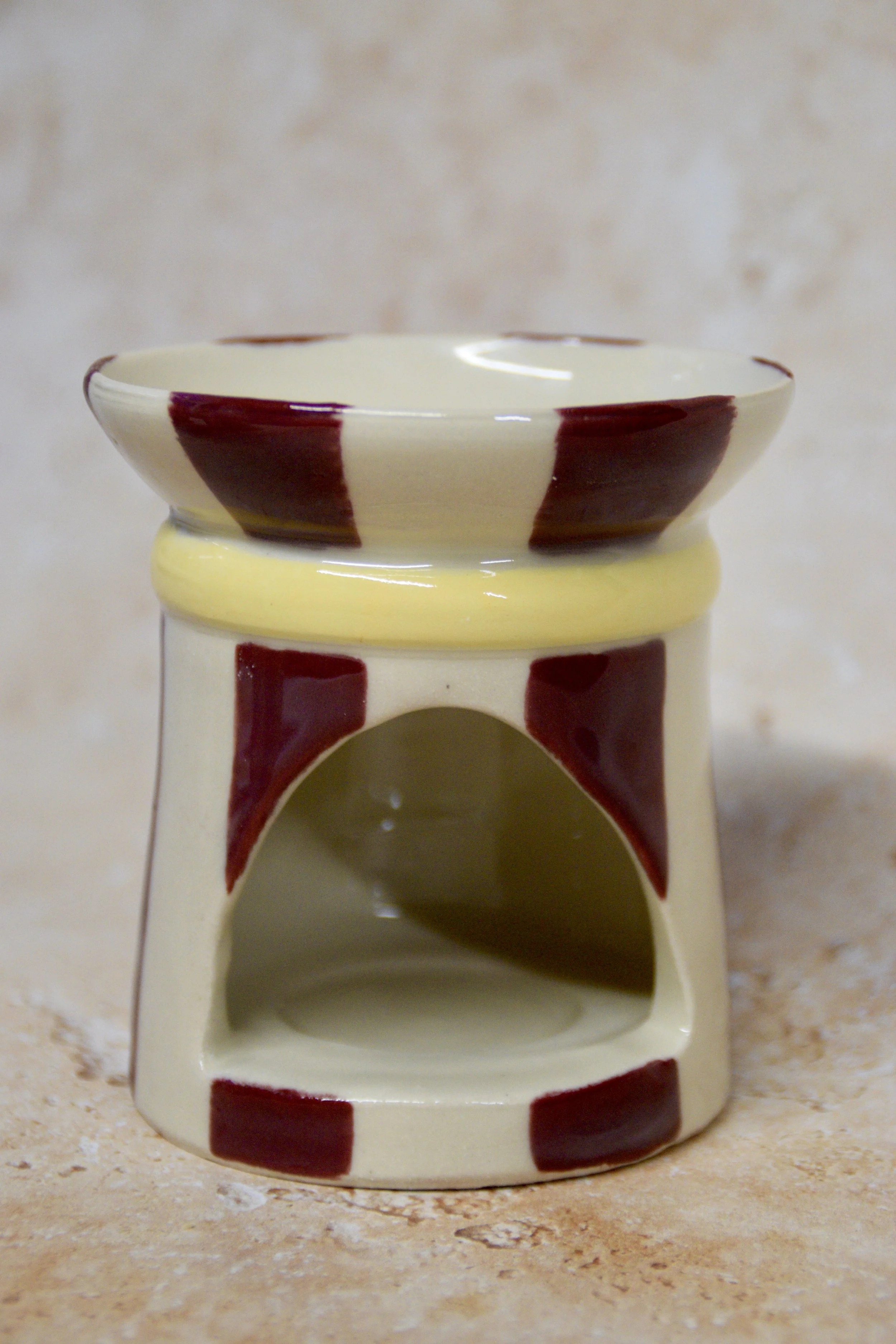 Burgundy and yellow striped ceramic wax burner