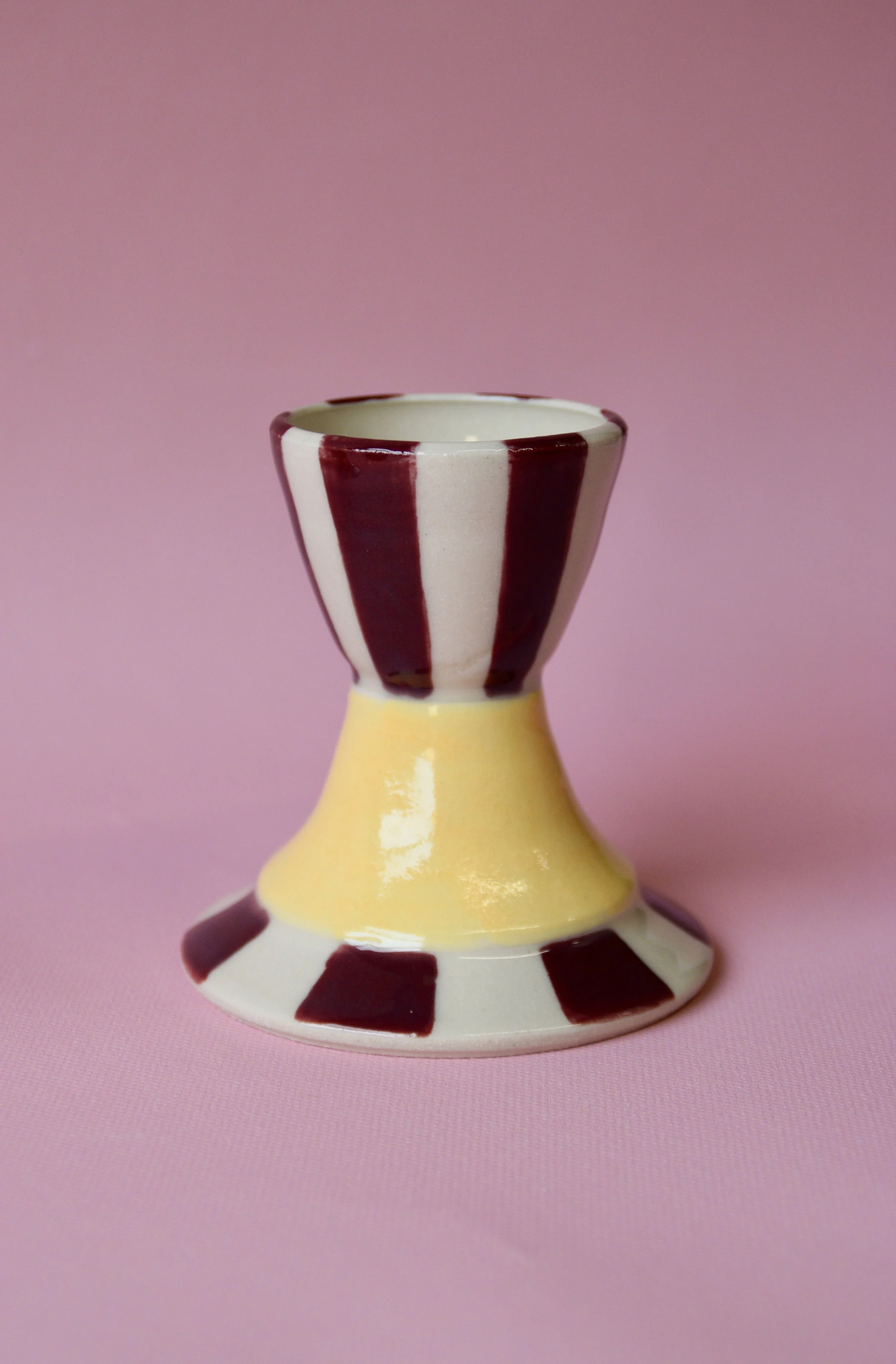 Burgundy and yellow striped ceramic egg cup