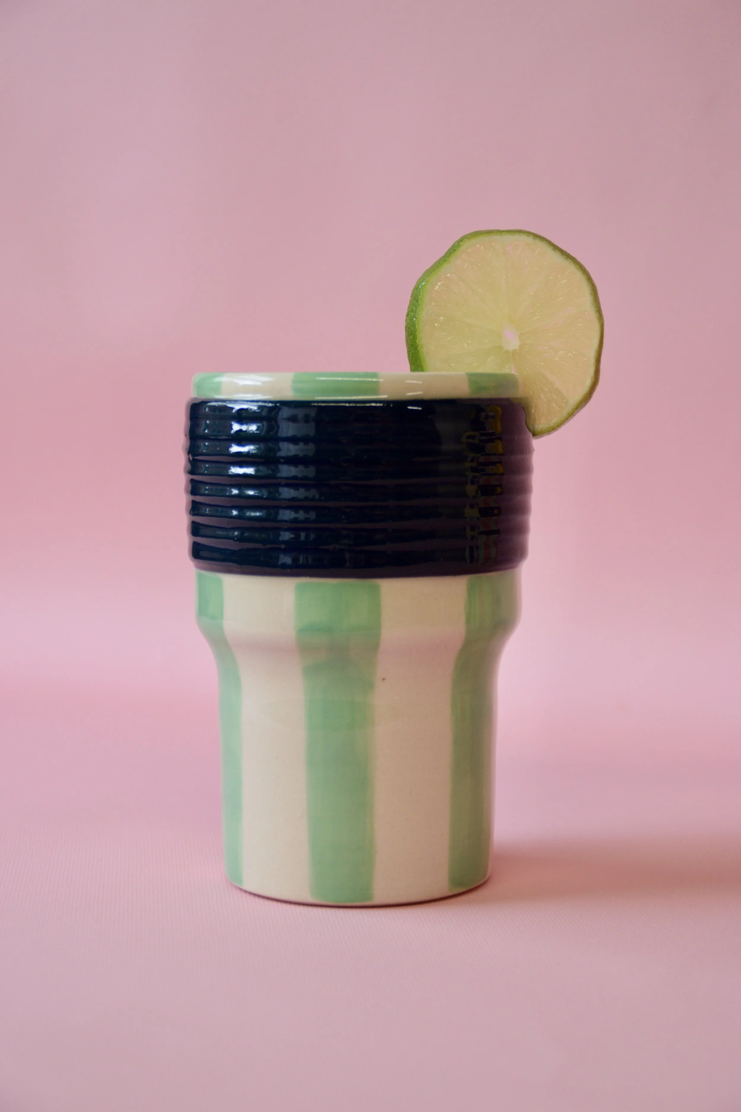 Green striped ceramic tumbler with lime