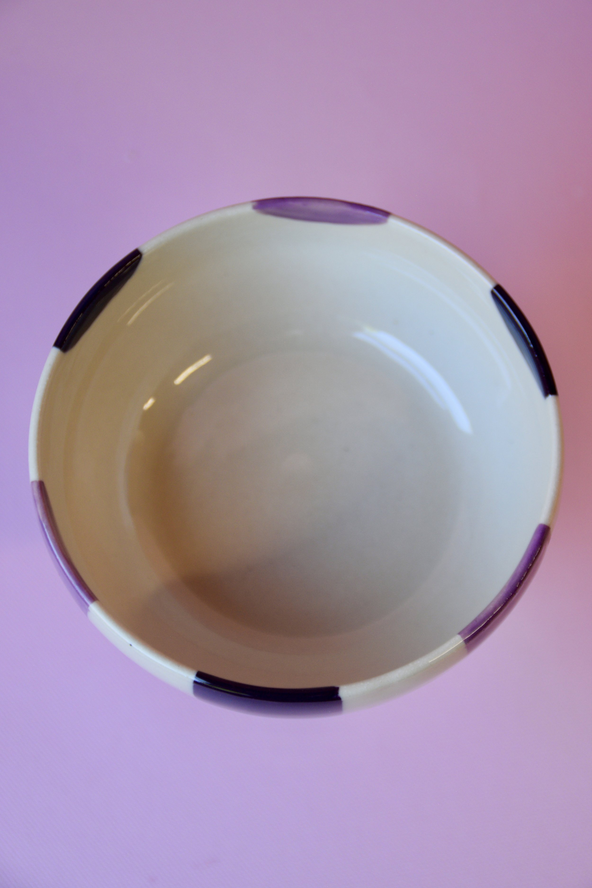 Purple striped ceramic dessert bowl showing inside detail