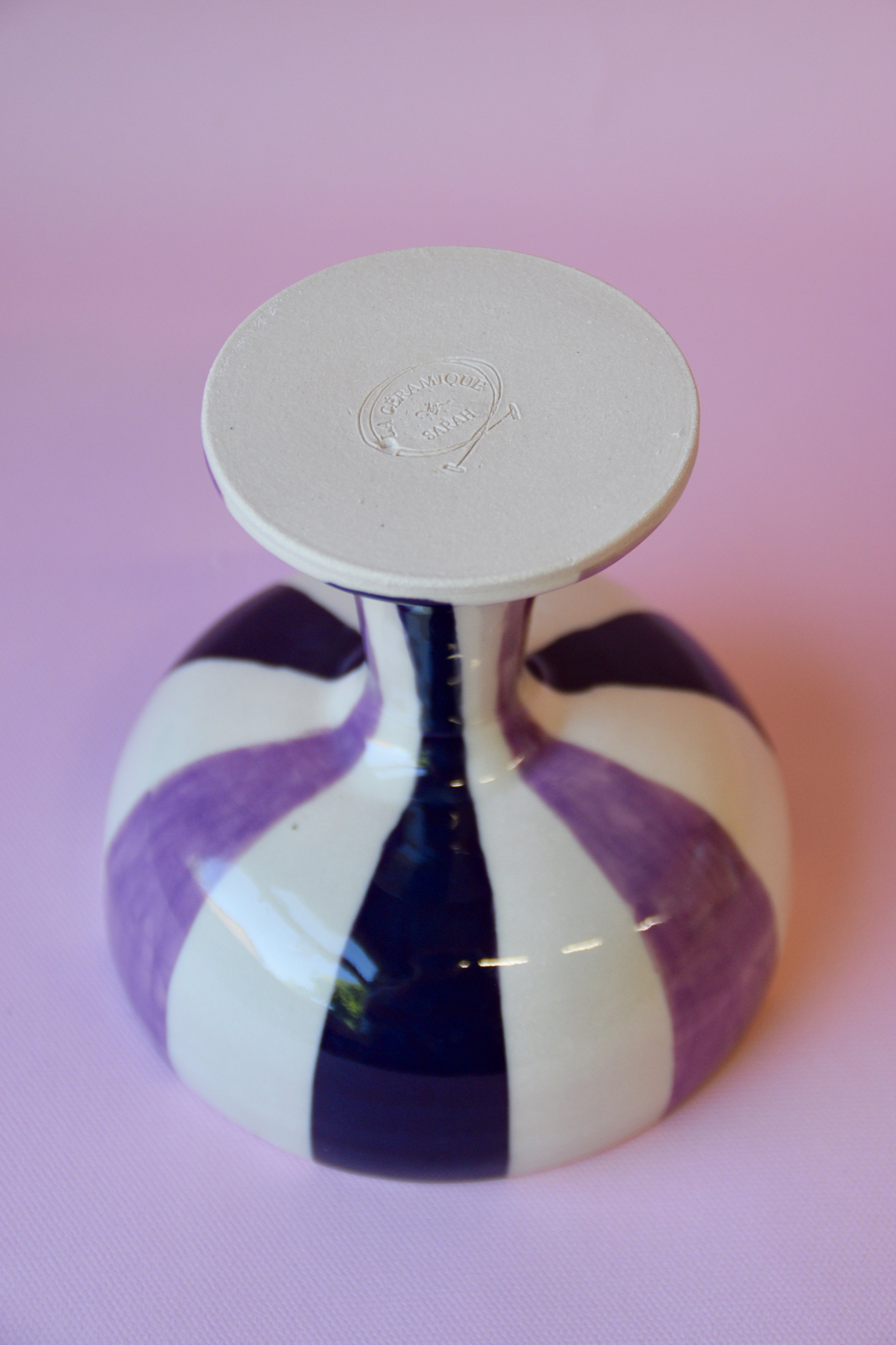 Purple striped ceramic dessert bowl showing base detail